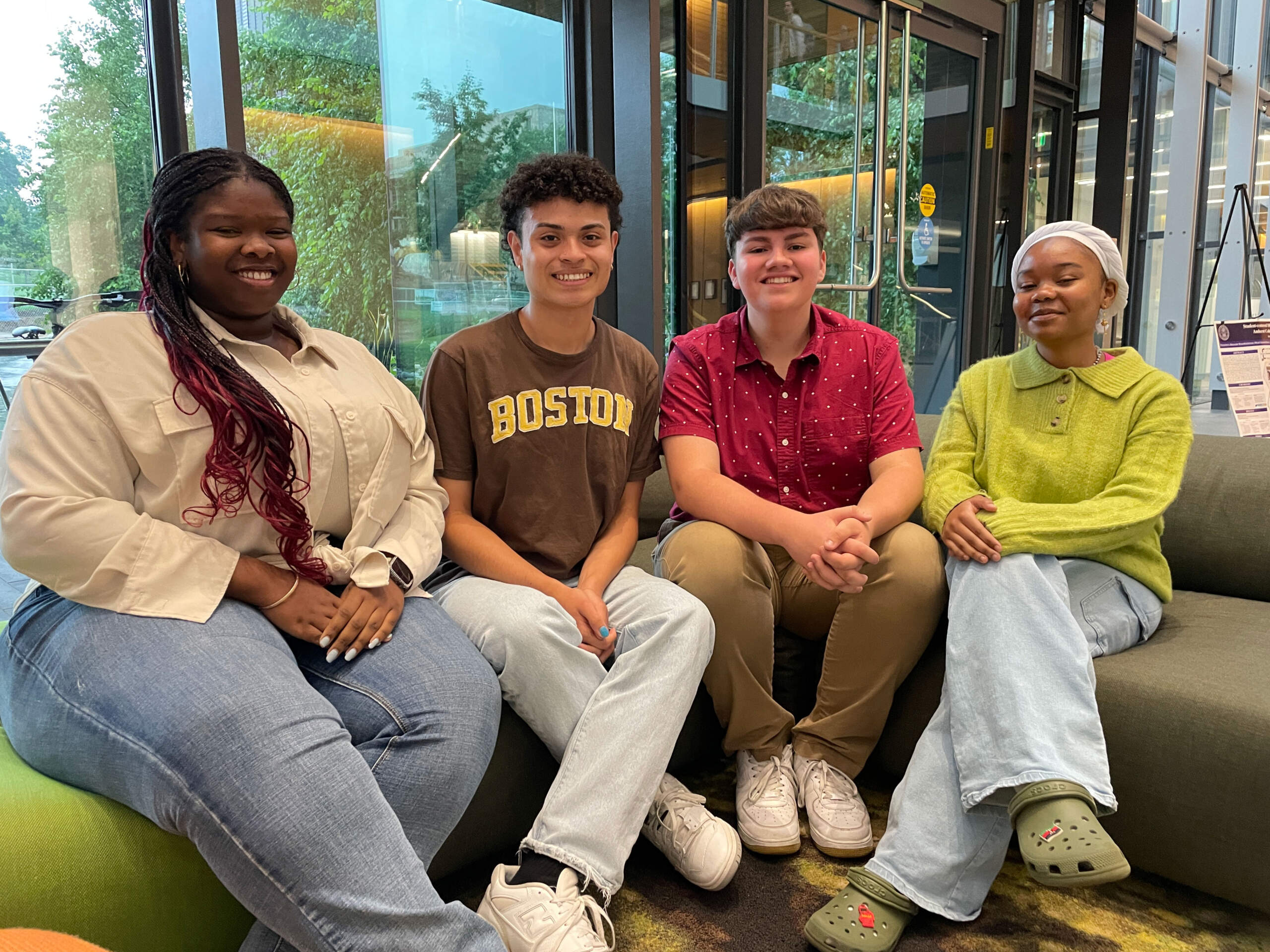 From left, Hannah Adeleye, Joshua Rodriguez Ortiz, Jimmy Merino and Farhiyo Omar — Thrive Scholars from Greater Boston — inside Amherst College's Science Center. (Max Larkin/WBUR)