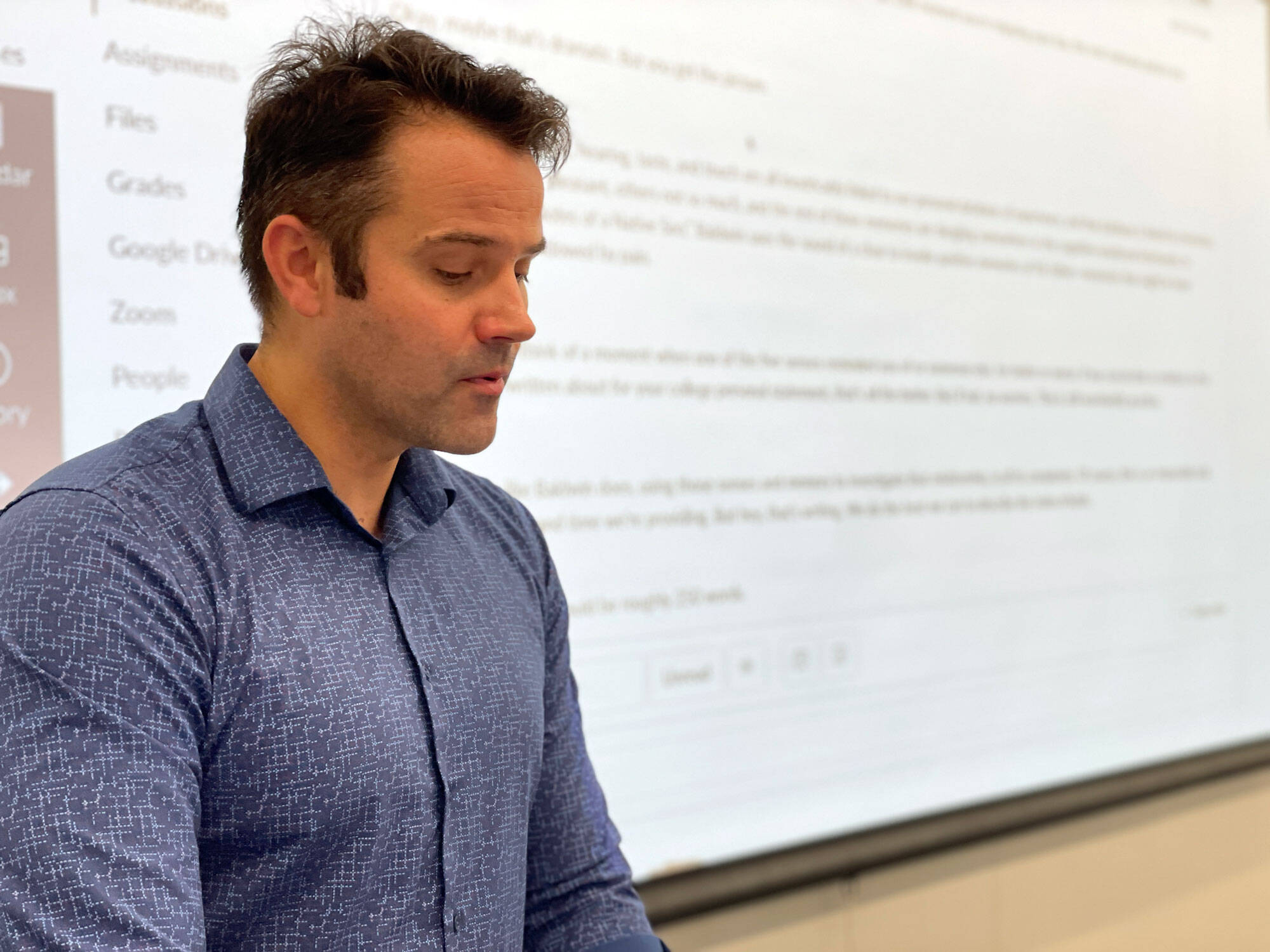 Stephen Shane, an instructor at the Summer Academy, shares a writing exercise with students. (WBUR/Max Larkin)