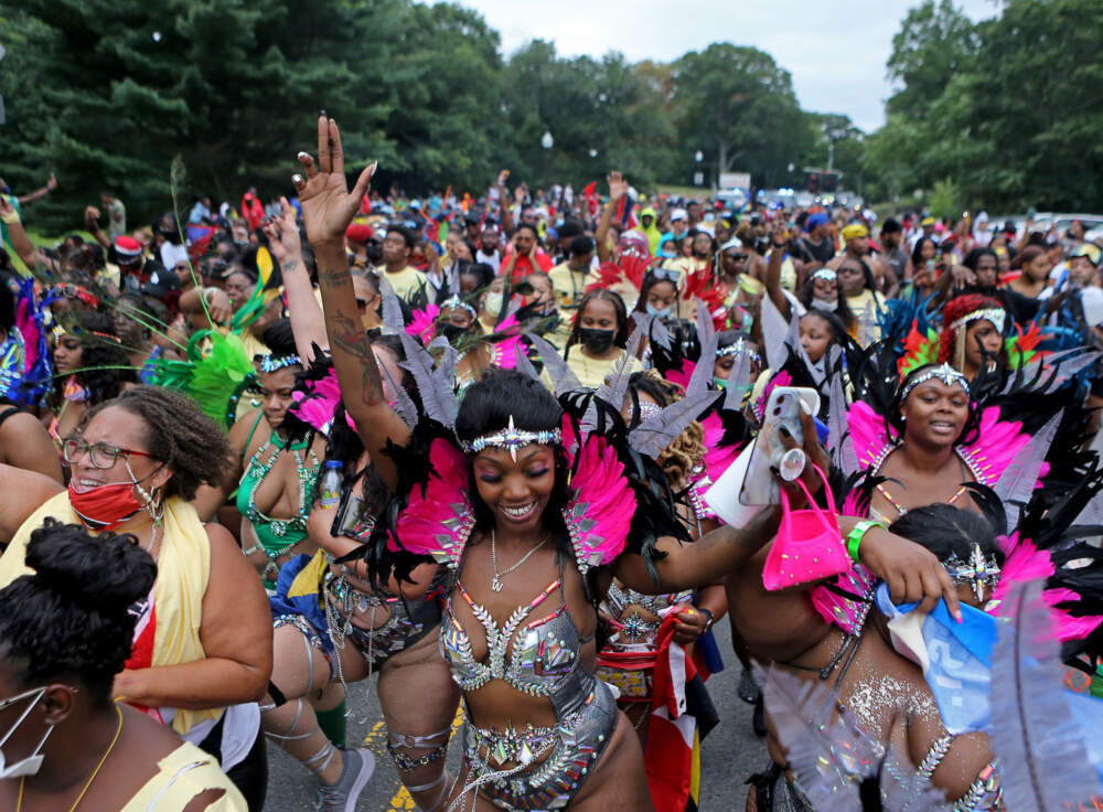 Revelers parade thru Franklin Park at the Caribbean Festival held at Playstead Park in 2021 in Boston. (Stuart Cahill/MediaNews Group/Boston Herald via Getty Images)