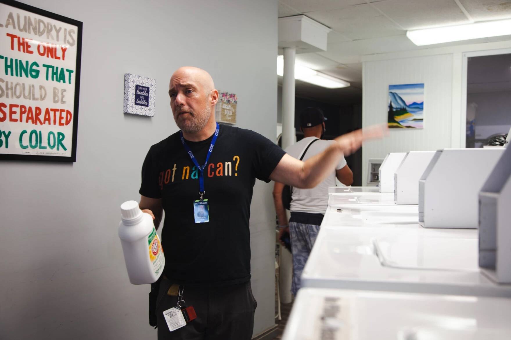 Dam Wright offers free Narcan at the Loads Of Love nights, although he hopes the broader community would not stigmatize unhoused people with substance use issues. When someone needs Narcan he puts it “discreetly in a paper bag, so they don’t feel shame.” (Gabriela Lozada/NHPR)