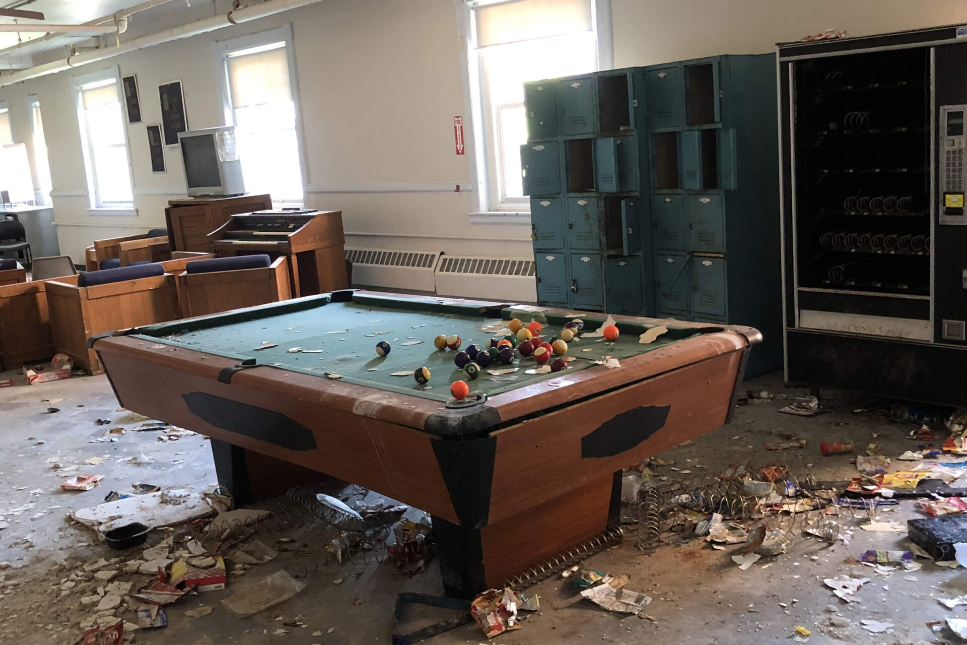 A room inside one of the buildings at the former Long Island recovery campus that has deteriorated over nearly a decade since social services there were shuttered when the city abruptly closed the bridge to the island. (Deborah Becker/WBUR)