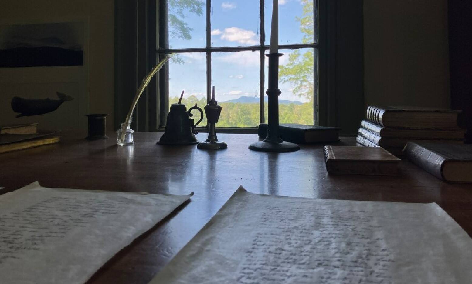 A replica of author Herman Melville's desk in Pittsfield, Massachusetts, where he could see Mount Greylock through the window. Melville wrote "Moby-Dick" here on the property called Arrowhead. The house is now a historic museum run by the Berkshire County Historical Society. (Nancy Eve Cohen/NEPM)
