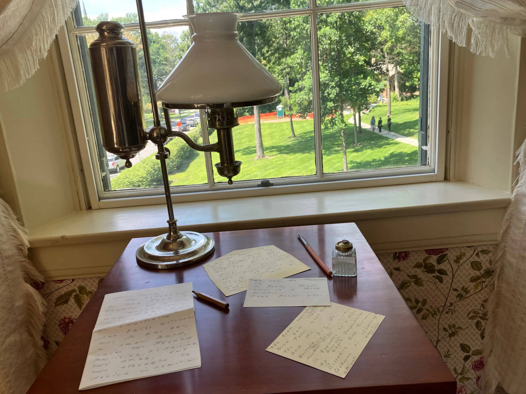 A replica of the small table in the Emily Dickinson Museum In Amherst, Massachusetts, where Dickinson wrote poems and letters. (Nancy Eve Cohen/NEPM)