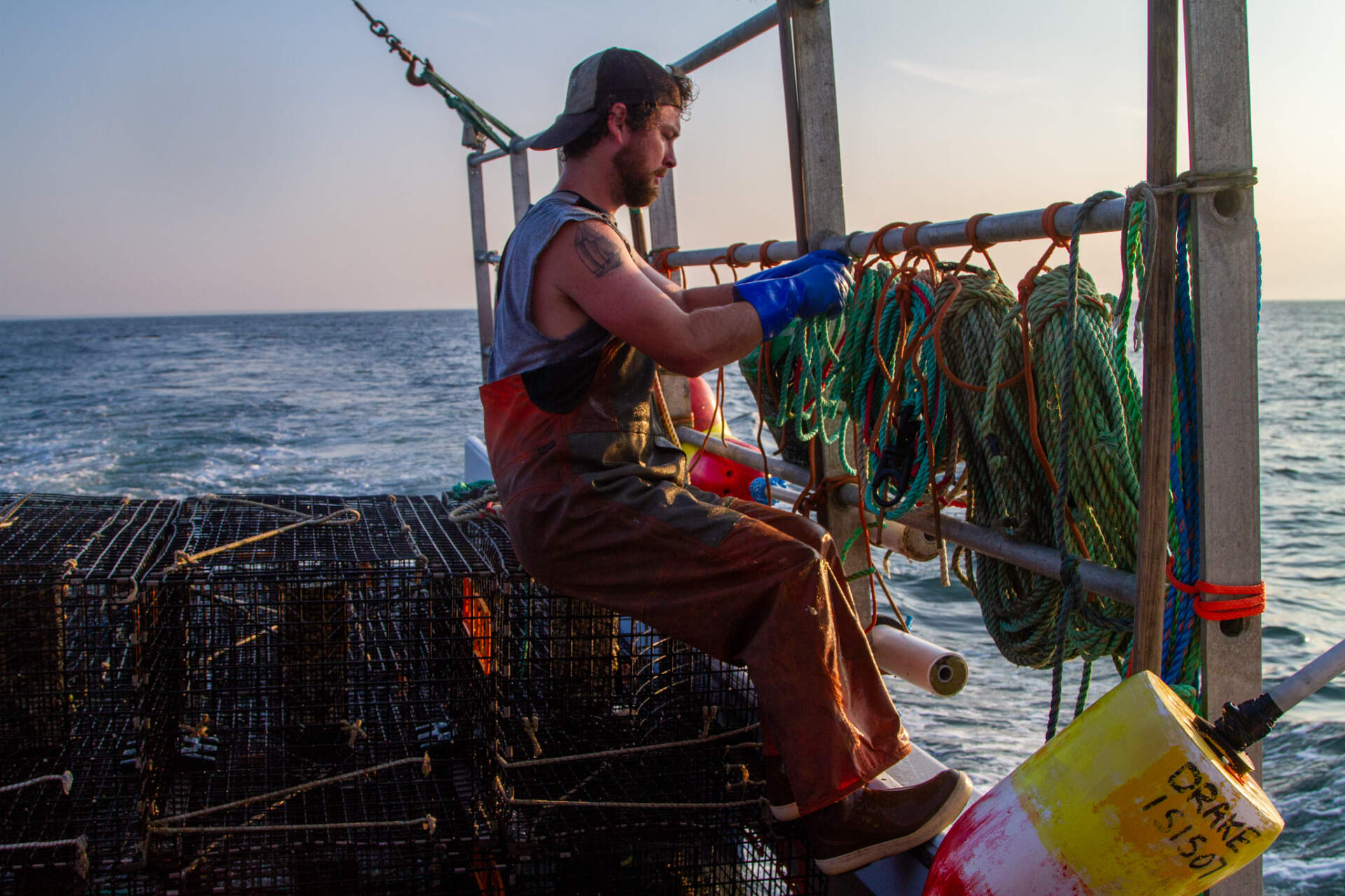Rob Sherman of Providence prepares fish traps. (Olivia Ebertz/The Public's Radio)