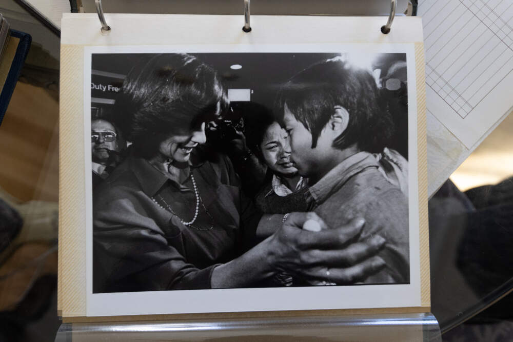 One of the many photos Pich Hout collected from when Kitty Dukakis had him flown to Massachusetts and greeted him at Logan Airport in 1985. (Jesse Costa/WBUR)