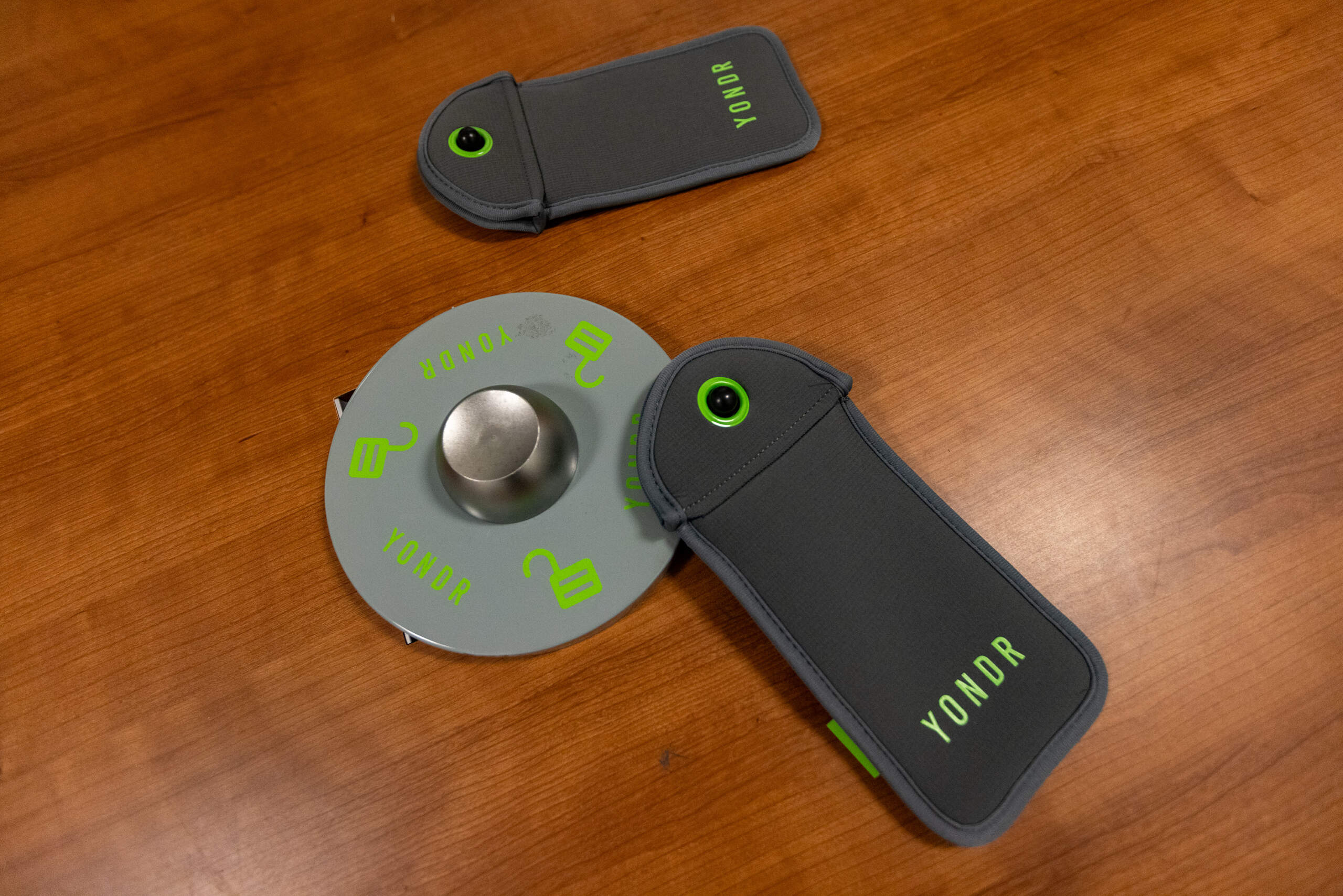 Two Yondr pouches and a locking base. (Jesse Costa/WBUR)
