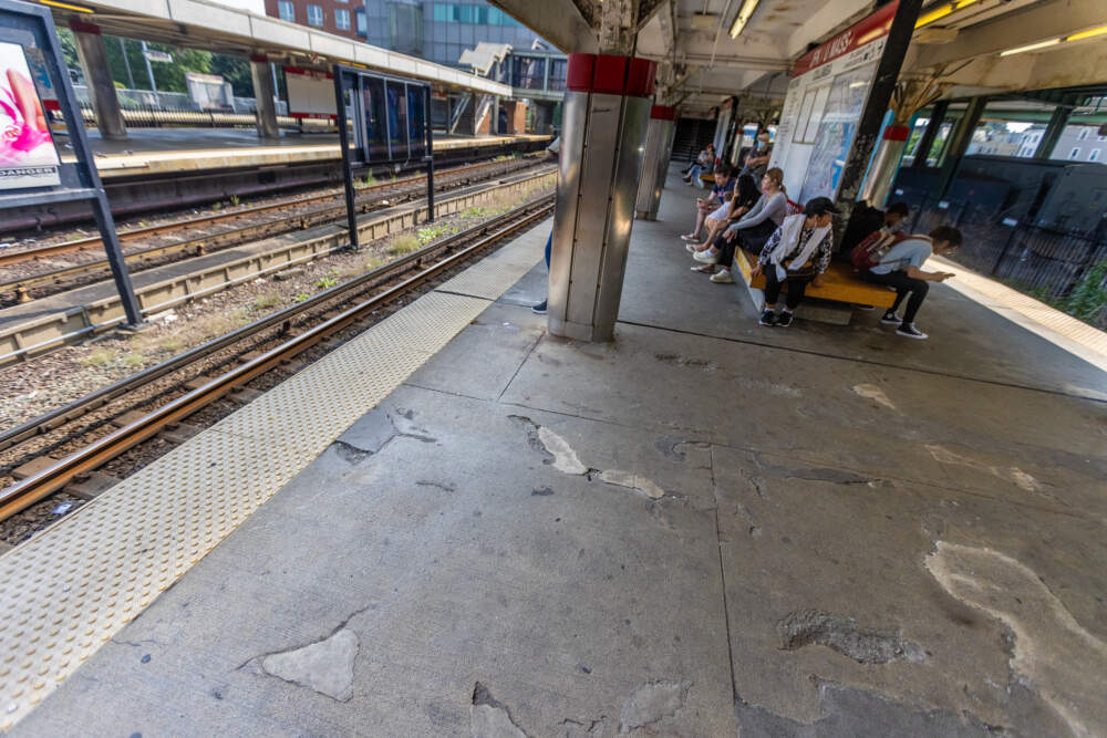 The platforms at JFK/UMass station have holes and cracks which need repairing and will be addressed when repairs begin. (Jesse Costa/WBUR)