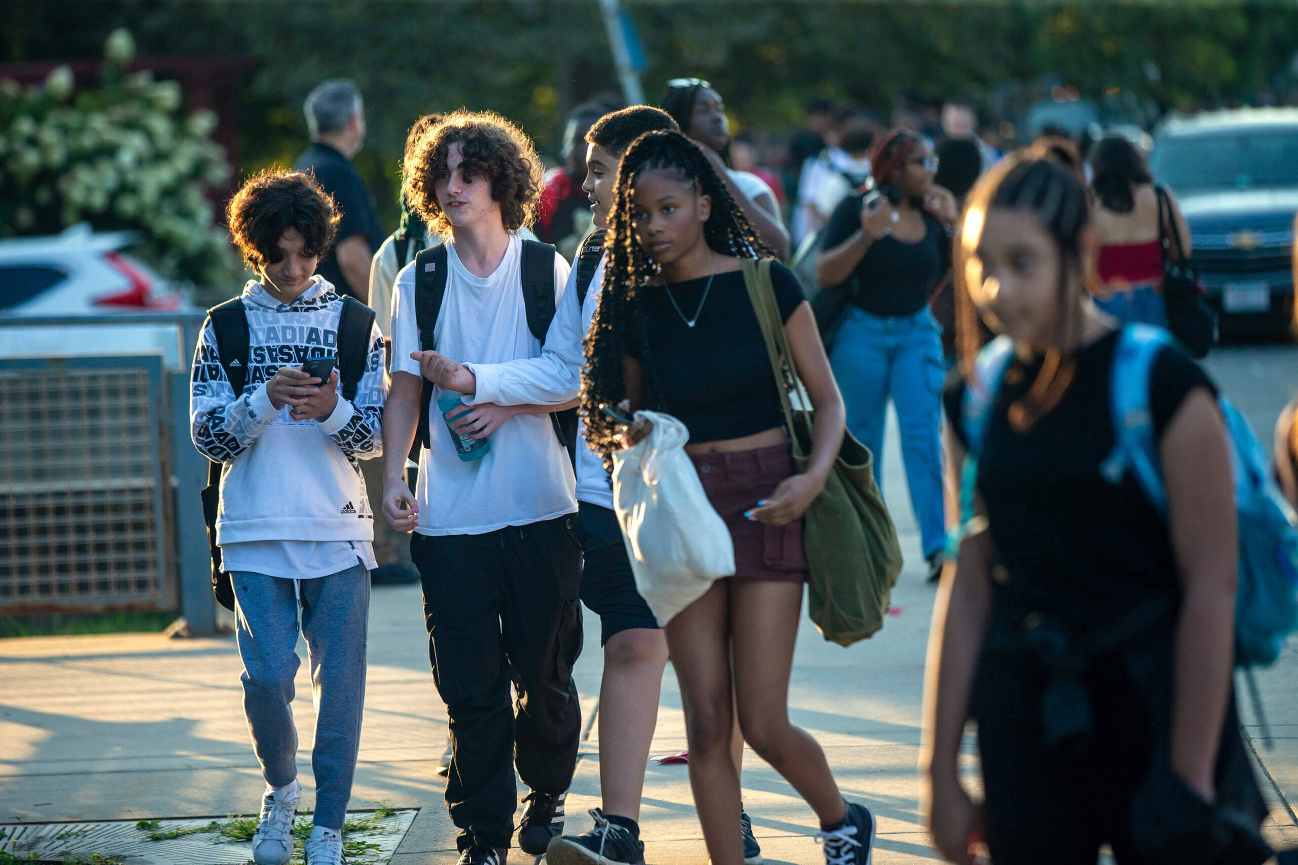 Students walk down Malcolm X Boulevard on their way to John D. O’ Bryant School in Roxbury. (Jesse Costa/WBUR)