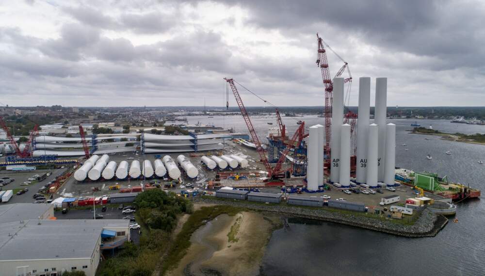 Wind turbine components are organized on the dock at New Bedford Marine Commerce Terminal to be shipped to their destinations off Martha's Vineyard, where they will be assembled at sea. (Robin Lubbock/WBUR)