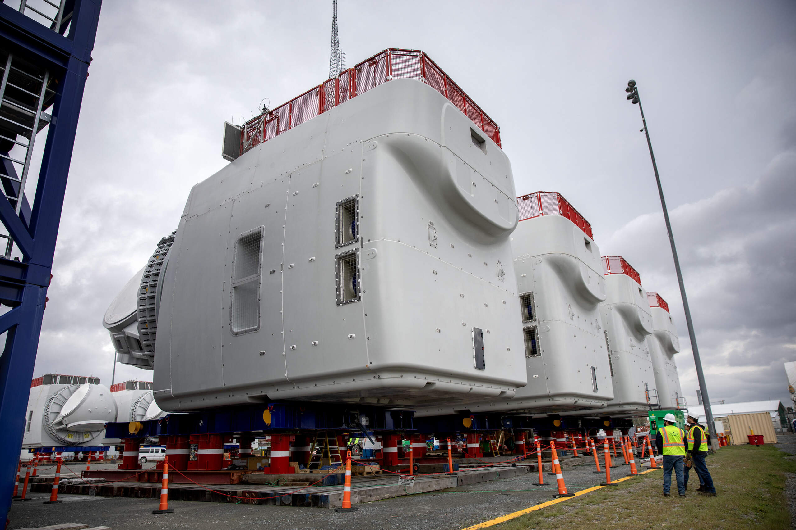 Four wind turbine nacelles wait at New Bedford Marine Commerce Terminal, ready to be shipped to their destinations off Martha's Vineyard. (Robin Lubbock/WBUR)