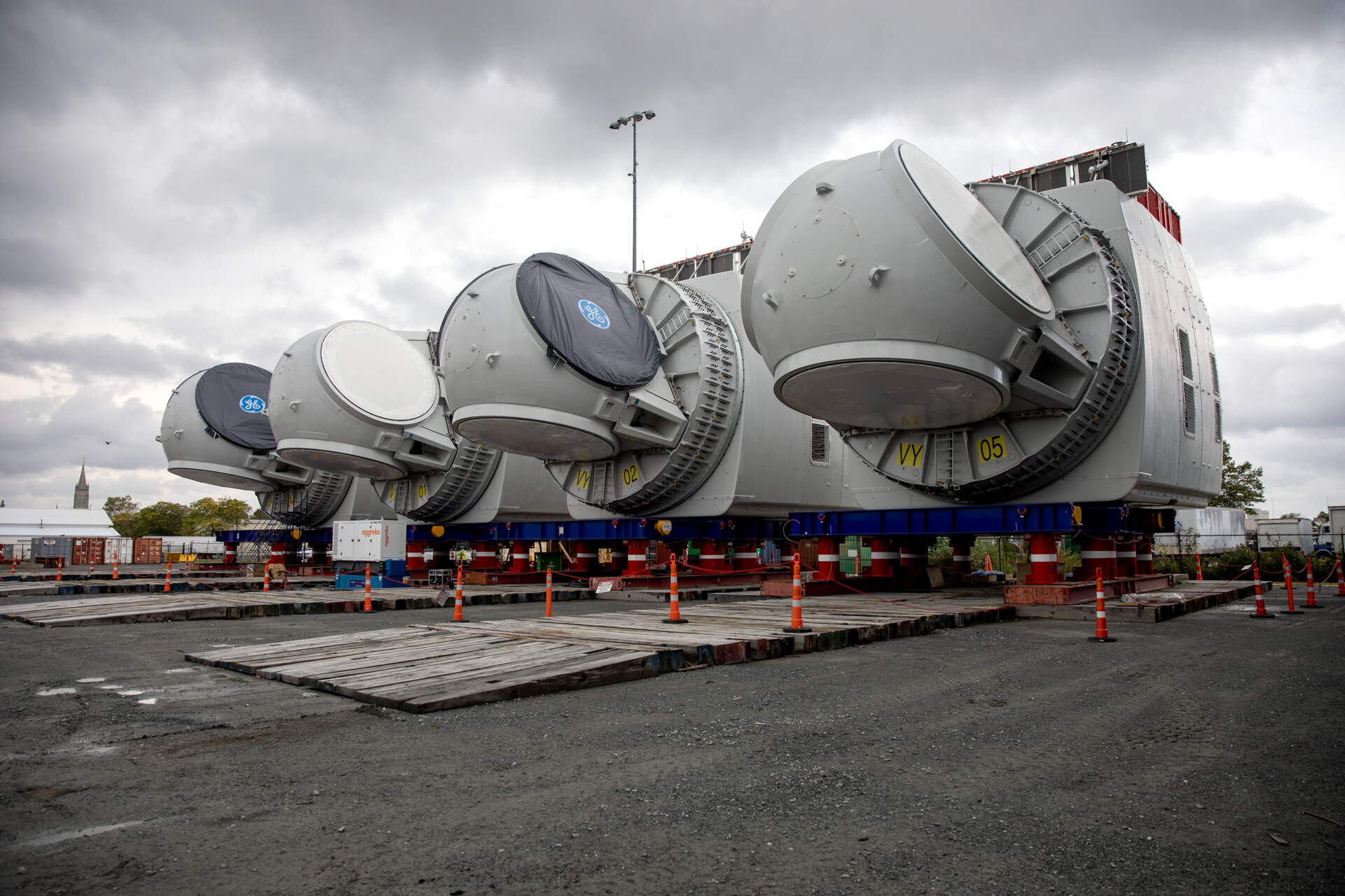 Four wind turbine nacelles wait at New Bedford Marine Commerce Terminal, ready to be shipped to their destinations off Martha's Vineyard. (Robin Lubbock/WBUR)