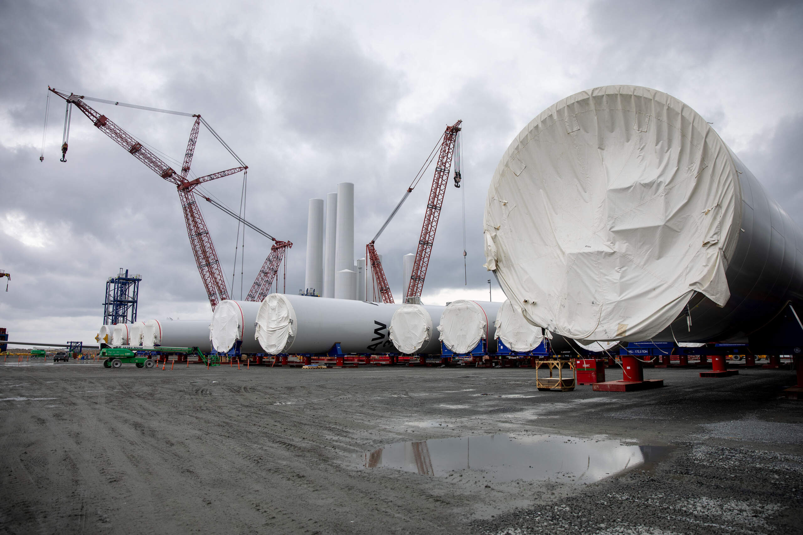 Wind turbine tower sections on the dock at the New Bedford Marine Commerce Terminal. (Robin Lubbock/WBUR)