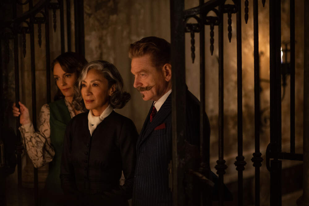 Tina Fey as Ariadne Oliver, Michelle Yeoh as Mrs. Reynolds and Kenneth Branagh as Hercule Poirot in 20th Century Studios' &quot;A Haunting in Venice.&quot; (Courtesy 20th Century Studios; photo by Rob Youngson)