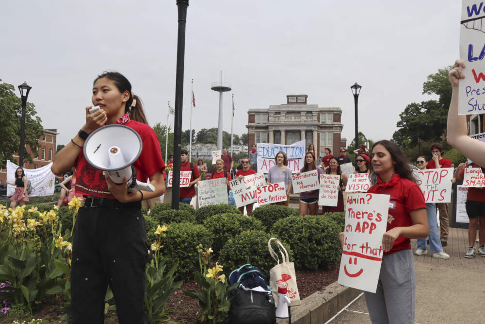 West Virginia University senior Mai-lyn Sadler leads a protest in the university's free speech zone outside the Mountainlair student union against cuts to programs in world languages, creative writing and more amid a $45 million budget deficit in Morgantown, W.Va., on Monday, Aug. 21, 2023. (Leah Willingham/AP)