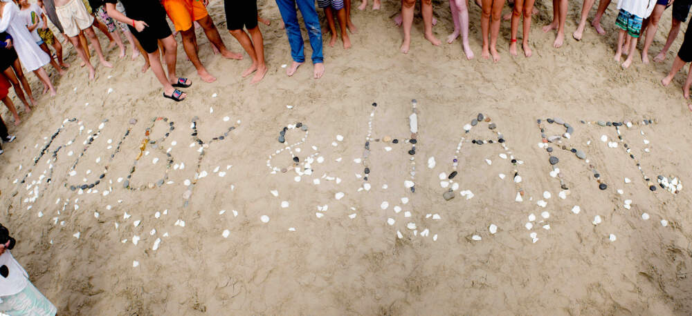 At the author's 50th birthday celebration, friends and family spelled out his children's names, Ruby and Hart, in rocks on the beach.  (Courtesy Colin Campbell)