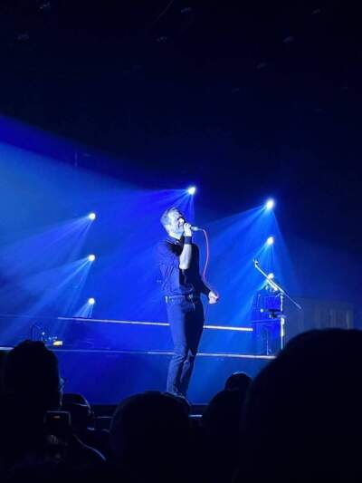 Ben Gibbard of Death Cab for Cutie, singing near the edge of the stage. Boston, 2023. (Courtesy Sara Schreur)