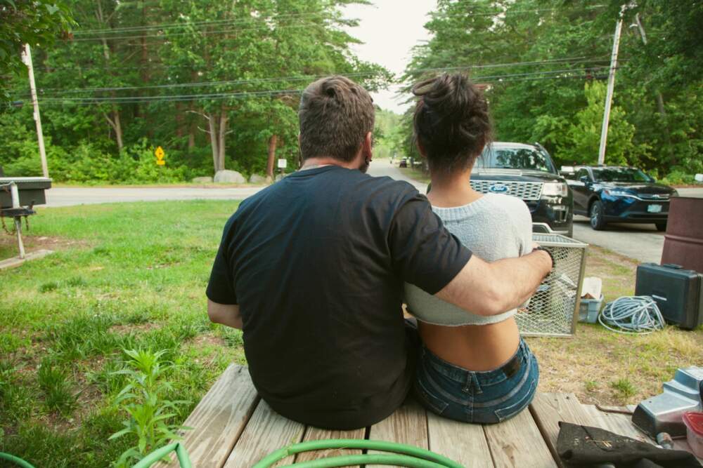 Diniz and Travis are a couple that has considered moving to Massachusetts, where, as of this summer, undocumented people and asylum seekers are allowed to get a driver’s license. But that would mean leaving the home and life they’ve built in New Hampshire. (Gabriela Lozada/NHPR)