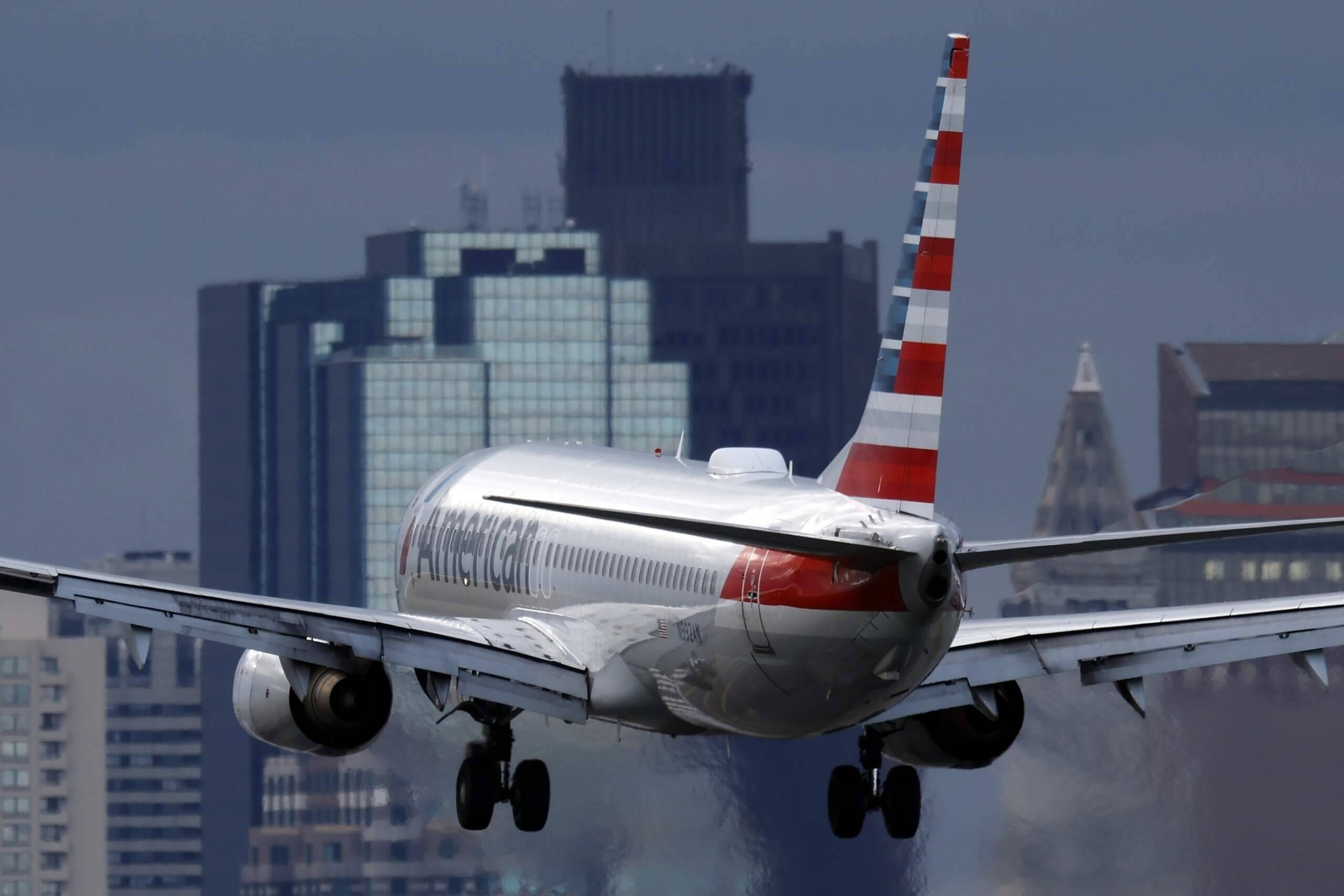 An American Airlines plane lands at Logan International Airport in Boston. (Michael Dwyer/AP)