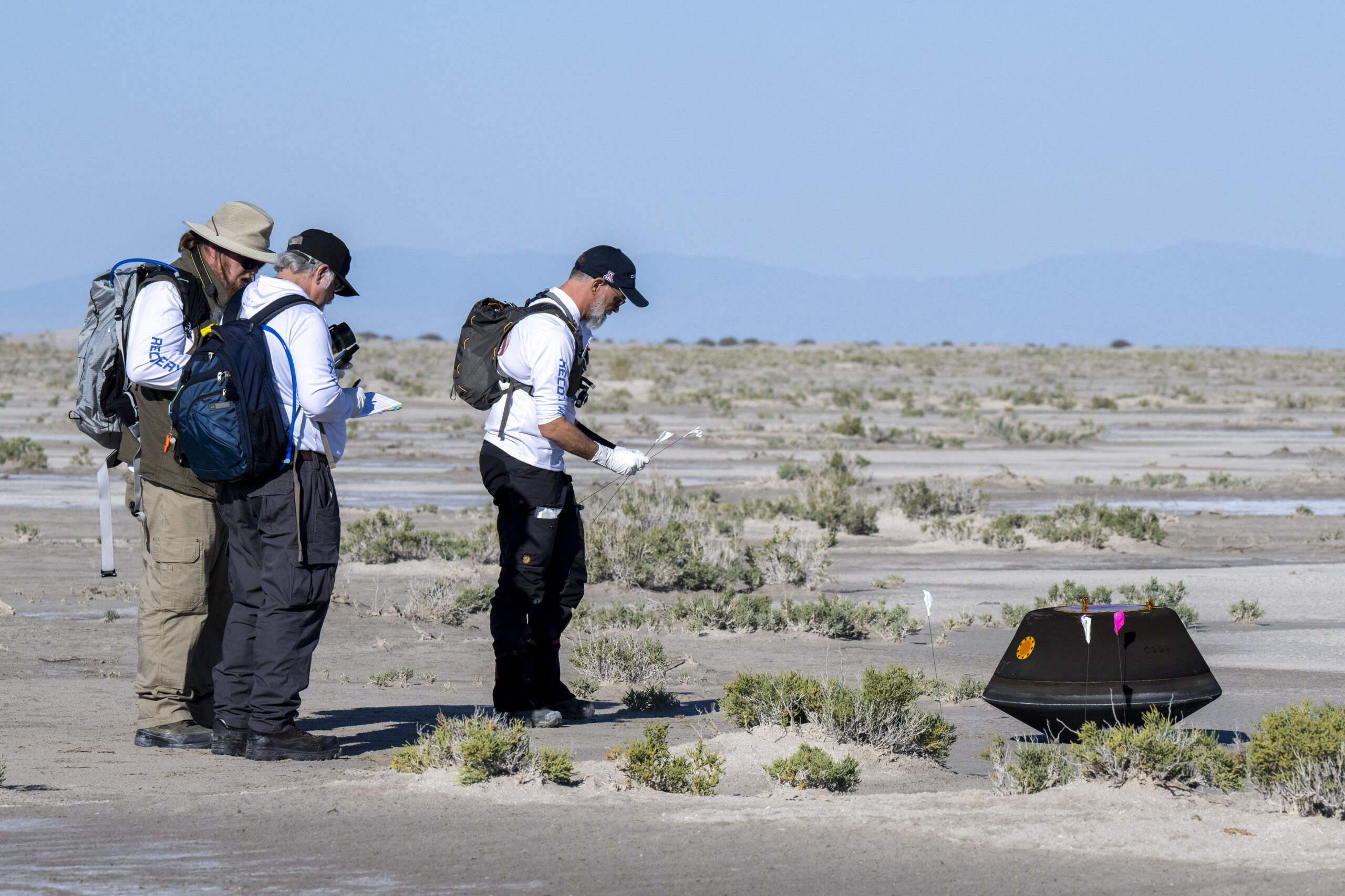 In this handout provided by NASA, The sample return capsule from NASA's OSIRIS-REx mission landed at the Department of Defense's Utah Test and Training Range. (Keegan Barber/NASA via Getty Images)