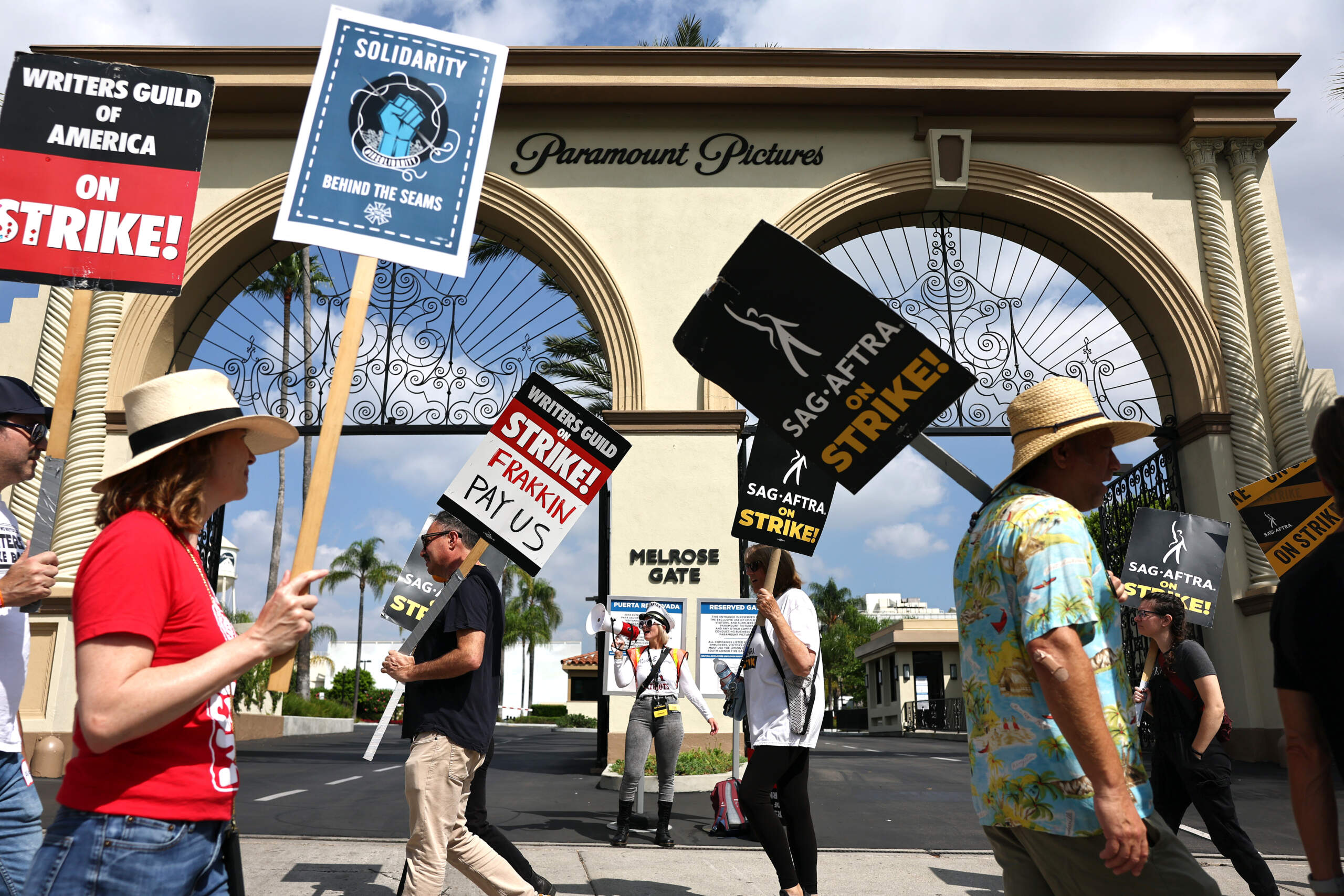 Strike captain SAG-AFTRA member Cari Ciotti calls out instructions as striking WGA (Writers Guild of America) members picket with striking SAG-AFTRA members outside Paramount Studios on September 18, 2023 in Los Angeles, California. (Mario Tama/Getty Images)