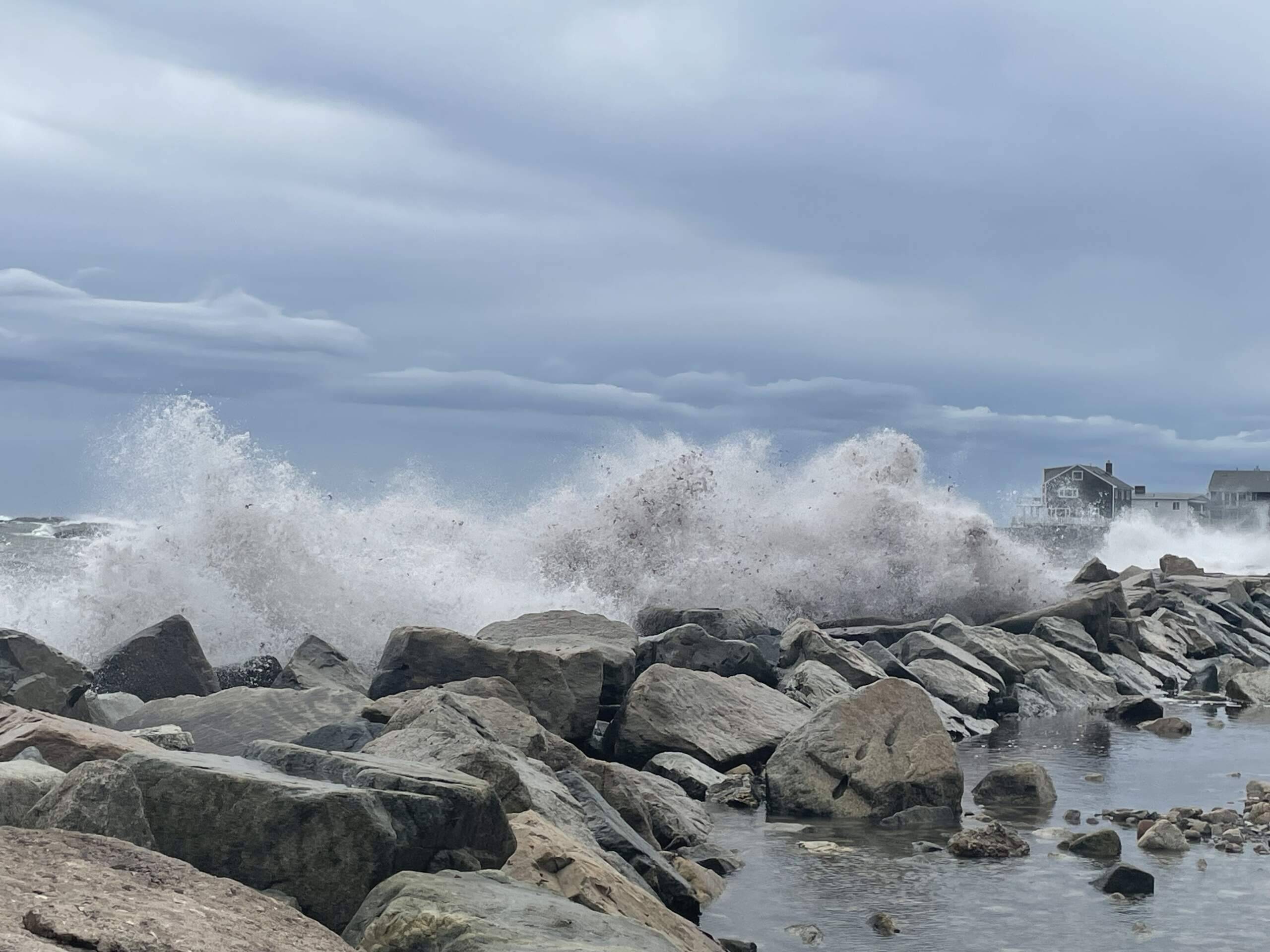 Strong waves hit a jetty at Minot beach in Scituate (Patrick Madden/WBUR)