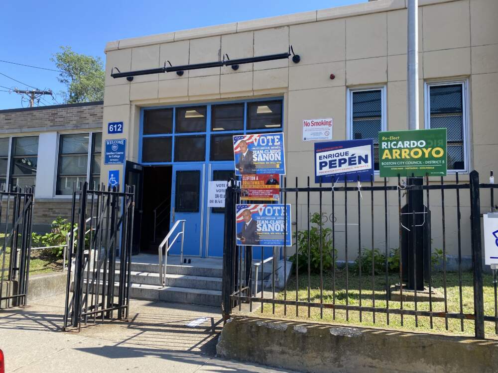 Campaign signs outside of an early voting center at Another Course to College in Hyde Park (Walter Wuthmann/WBUR).