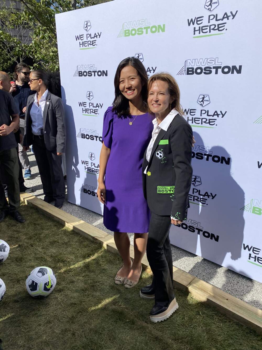 Boston Mayor Michelle Wu and Boston Unity Soccer Partners principal Jennifer Epstein celebrate the city's successful bid for a new professional women's soccer team (Walter Wuthmann/WBUR).