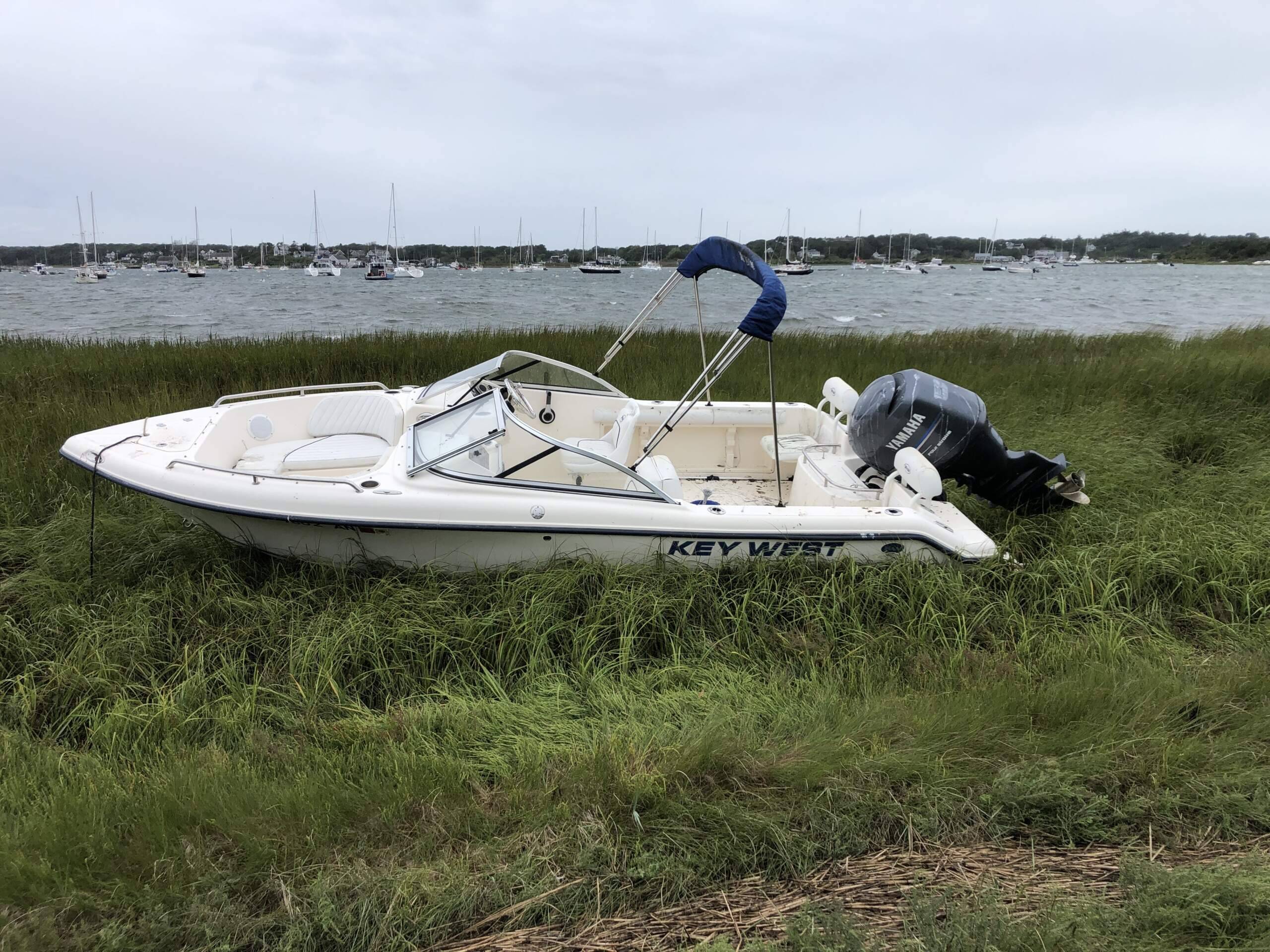 A boat broke loose from its mooring in Stage Harbor in Chatham. (Lynn Jolicoeur/WBUR)