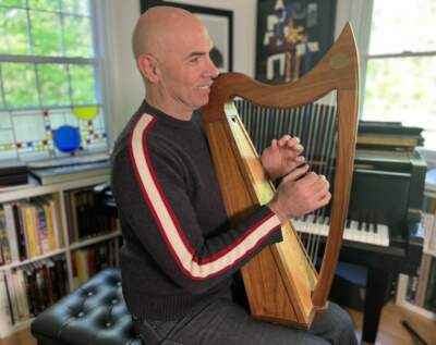 Eric Shimelonis playing the lap harp (credit: Rebecca Sheir).