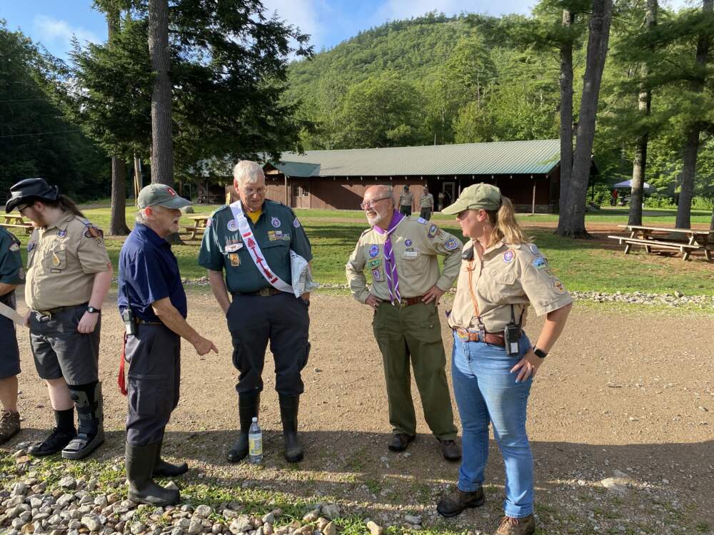 Tom Andrew, second from right, chatting with scoutmasters and staffers before dinner. (Anthony Brooks/WBUR)