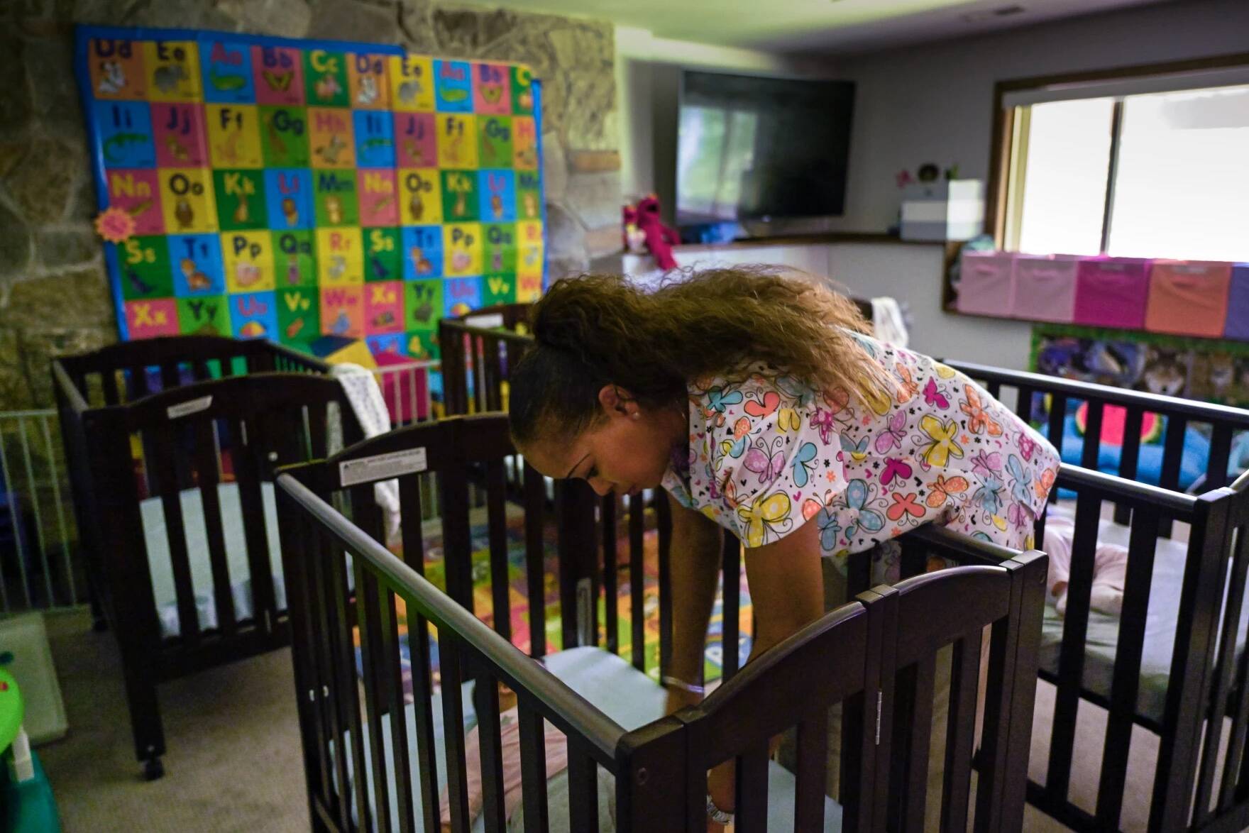 Nichelle Waddell, owner of Watch Me Grow Daycare in Stamford, takes care of 12 children with four staff members in her home. Waddell is a strong supporter of a bill signed by Governor Lamont in June aimed at helping address a shortage of childcare providers. (Mark Mirko/Connecticut Public Radio)