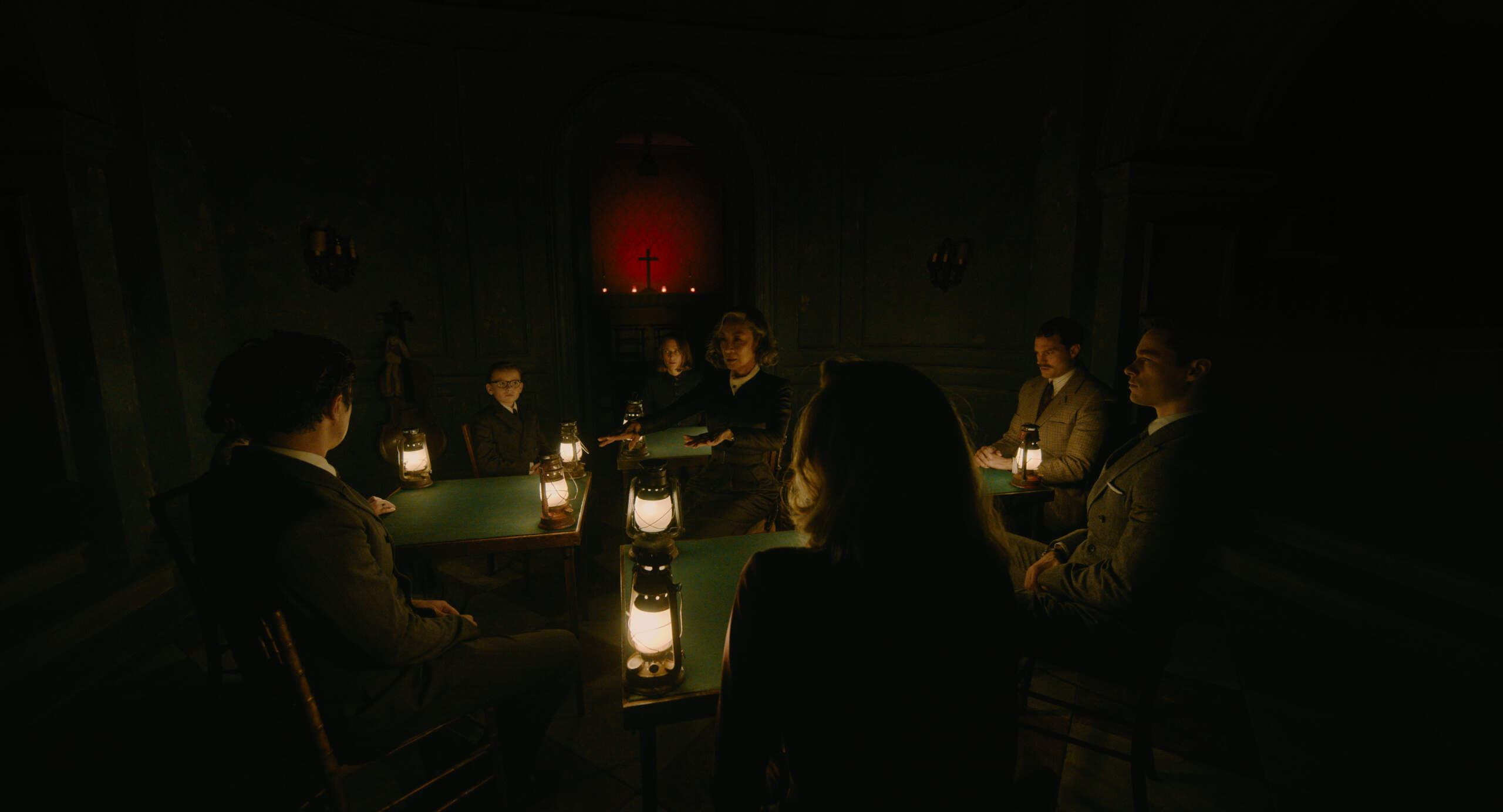 (Facing front, L-R): Jude Hill as Leopold Ferrier, Camille Cottin as Olga Seminoff, Michelle Yeoh as Mrs. Reynolds, Jamie Dornan as Dr. Leslie Ferrier and Kyle Allen as Maxime Gerard in 20th Century Studios' "A Haunting in Venice." (Courtesy 20th Century Studios)