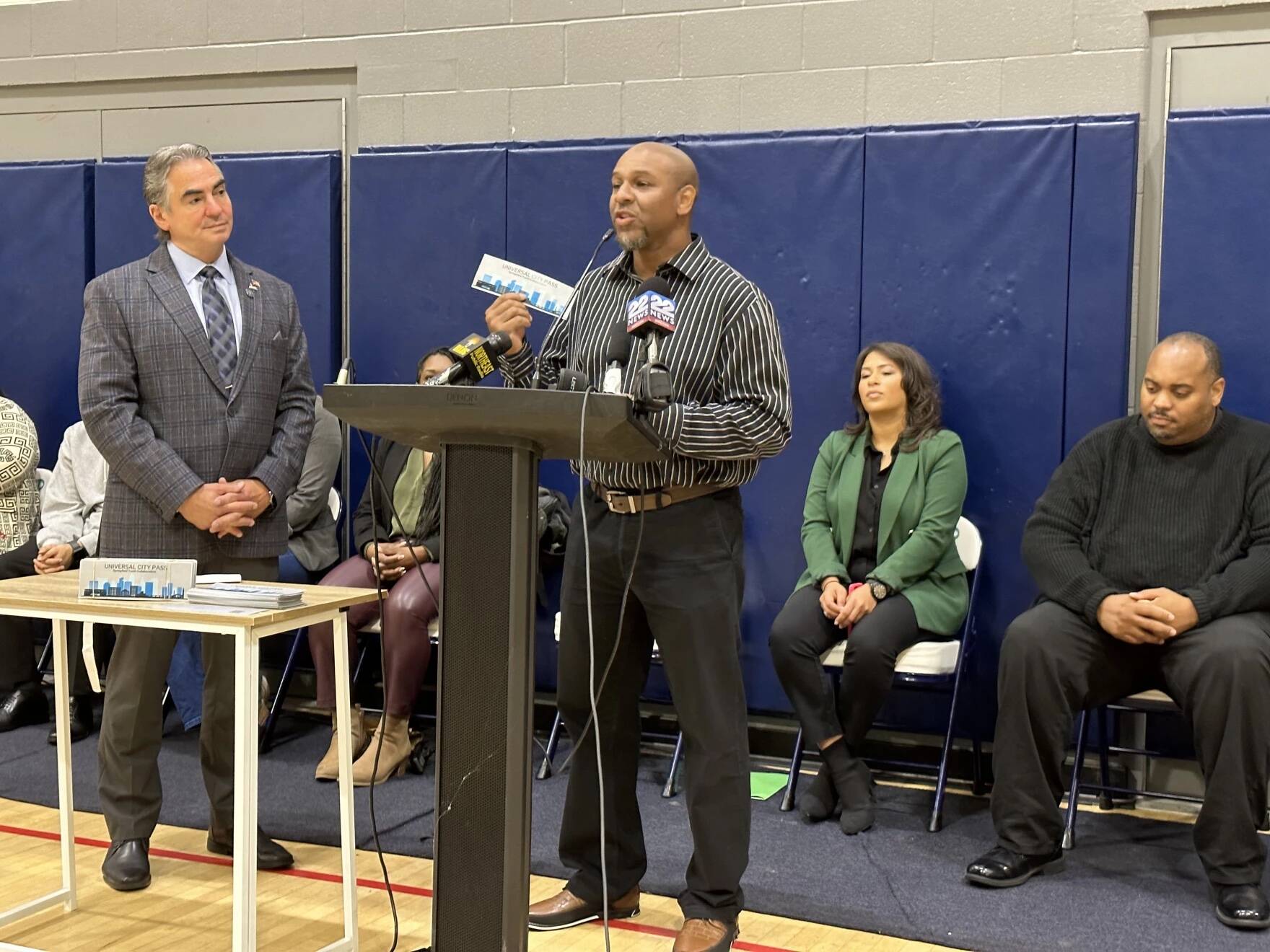Keshawn Dodds, executive director of the Boys and Girls Family Center, holds up a new universal city pass in Springfield, Massachusetts, on September 25, 2023. (Alden Bourne/NEPM)