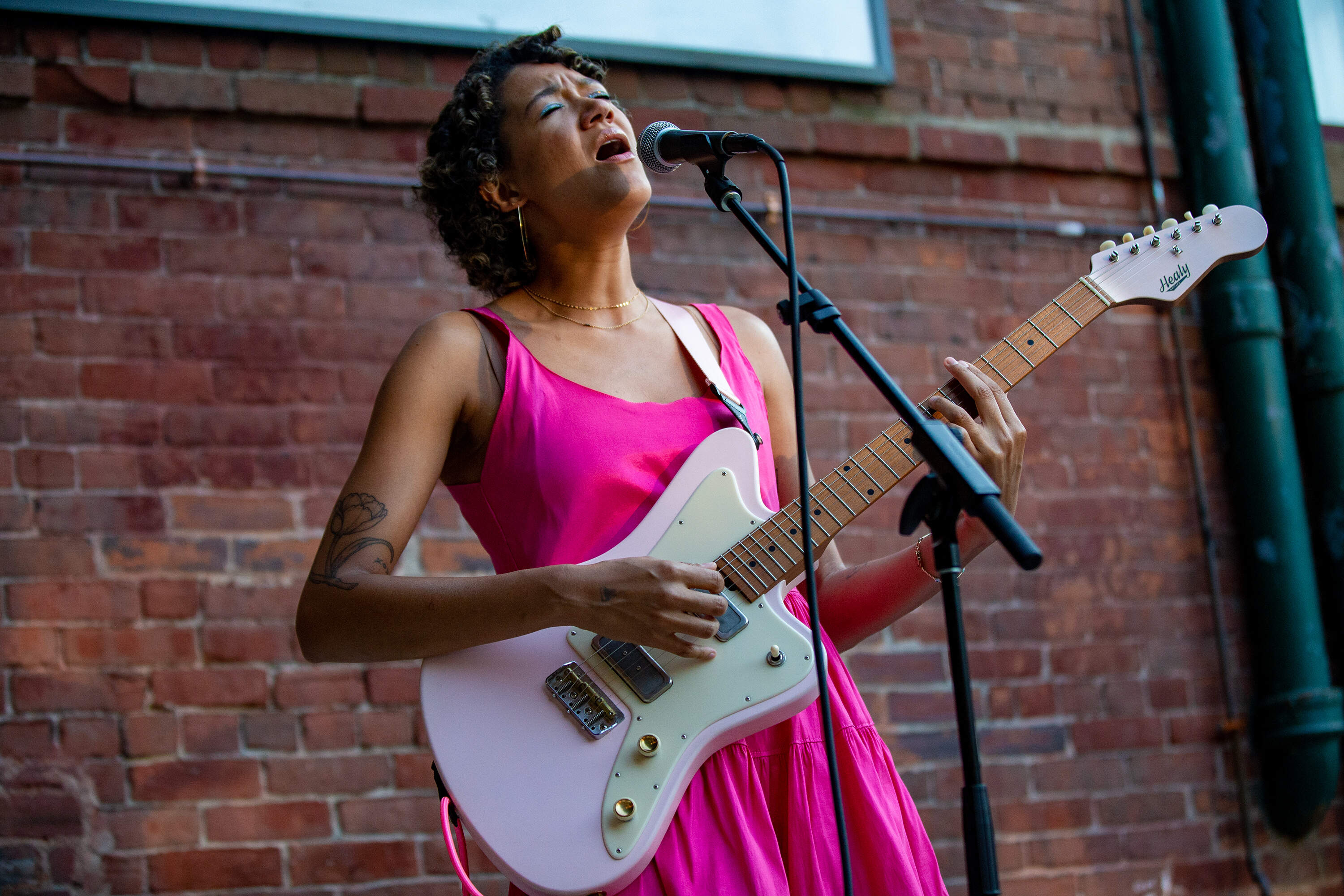 Kimaya Diggs performing during a Sofar Sounds night at Sam Adams Brewery in Jamaica Plain. (Jesse Costa/WBUR)