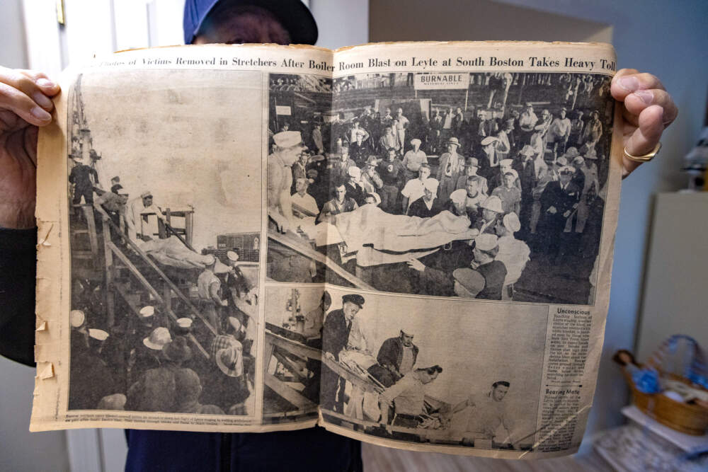 Jim Tsihlis holds the Oct. 17, 1953 issue of the Daily Record. (Jesse Costa/WBUR)