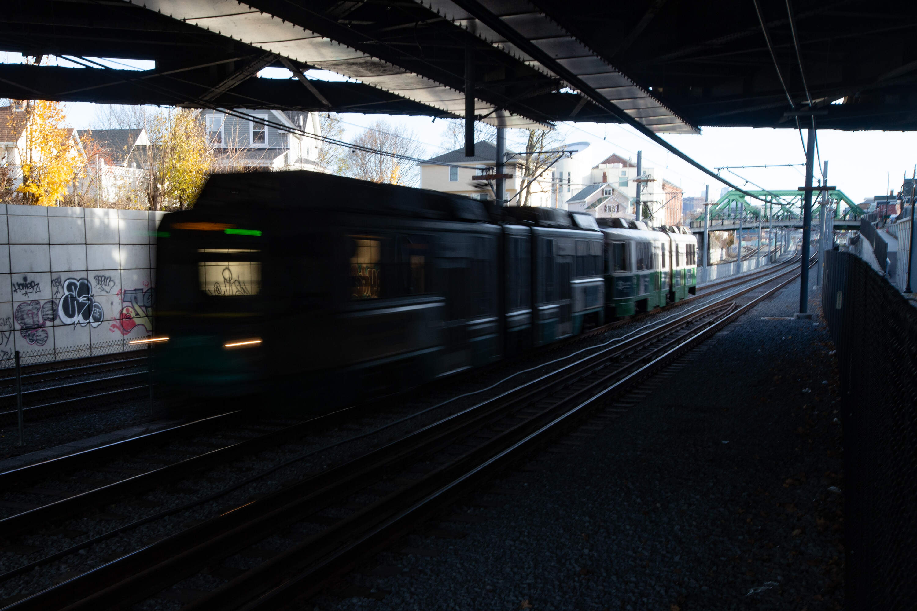 An MBTA Green Line train travels under the McGrath Highway Bridge in Somerville during the Green Line Extension train testing. (Jesse Costa/WBUR)