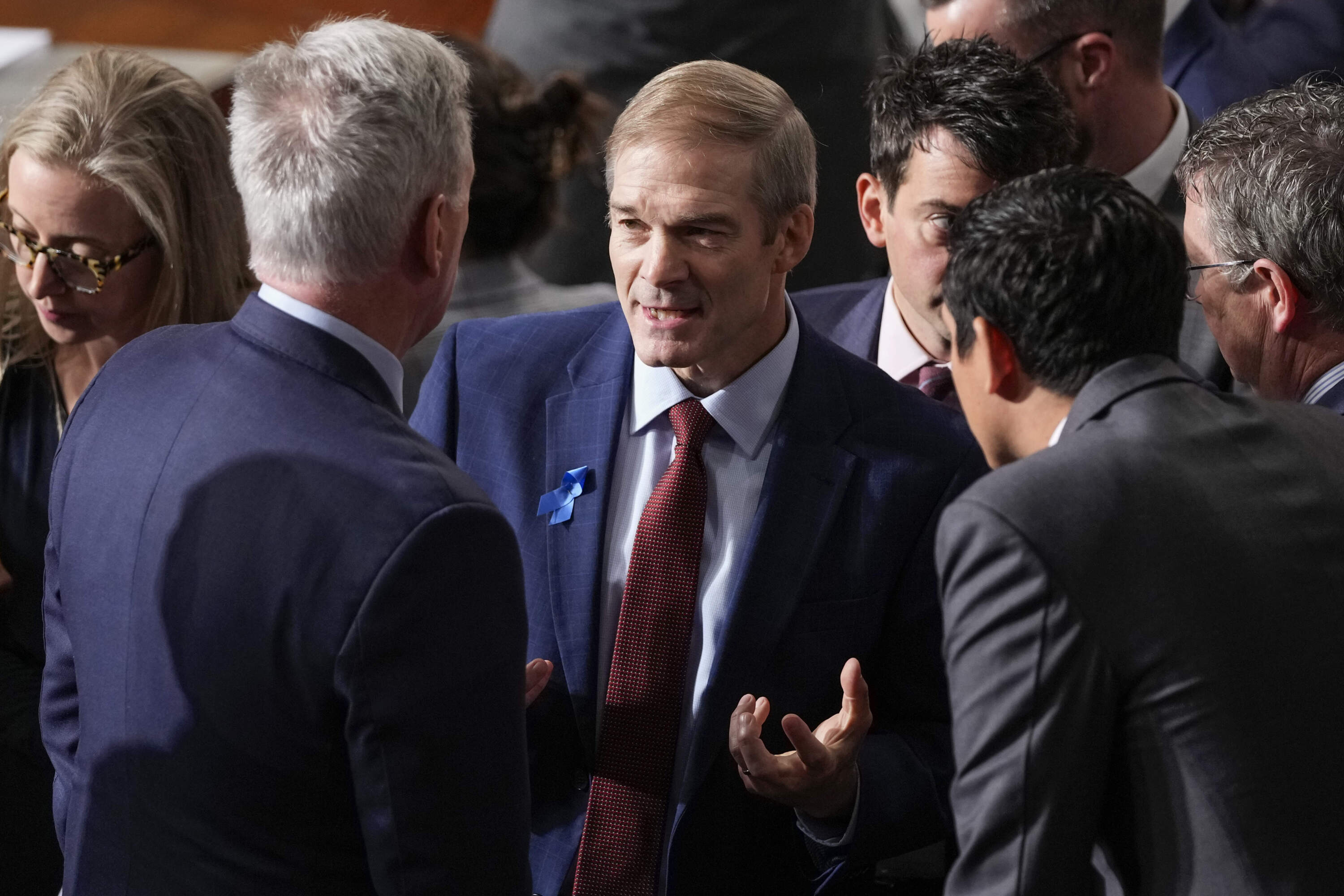Rep. Jim Jordan, R-Ohio, talks with Rep. Kevin McCarthy, R-Calif., and others as Republicans try to elect Jordan to be the new House speaker. (Alex Brandon/AP)