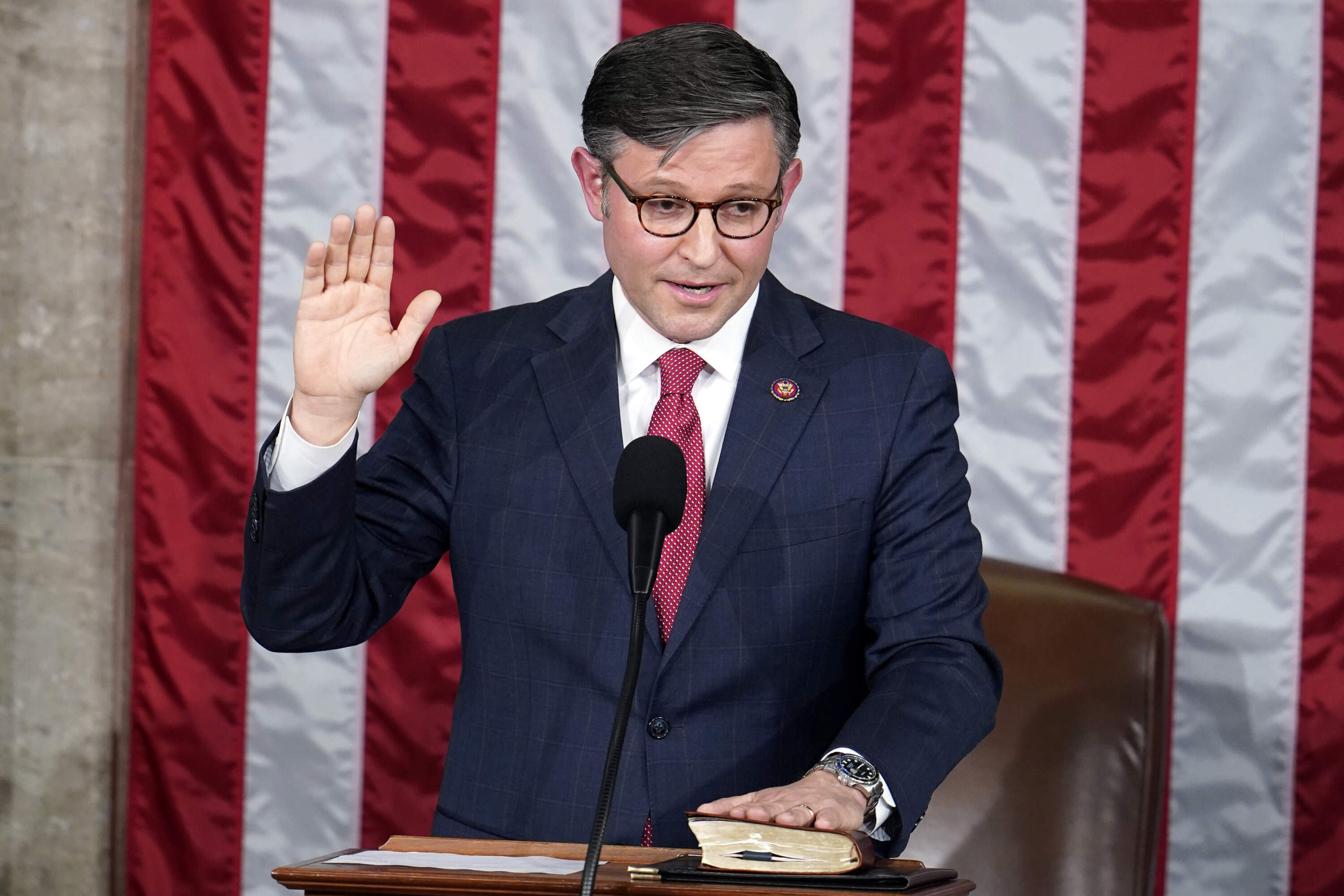 Rep. Mike Johnson, R-La., takes the oath to be the new House speaker. (Alex Brandon/AP)
