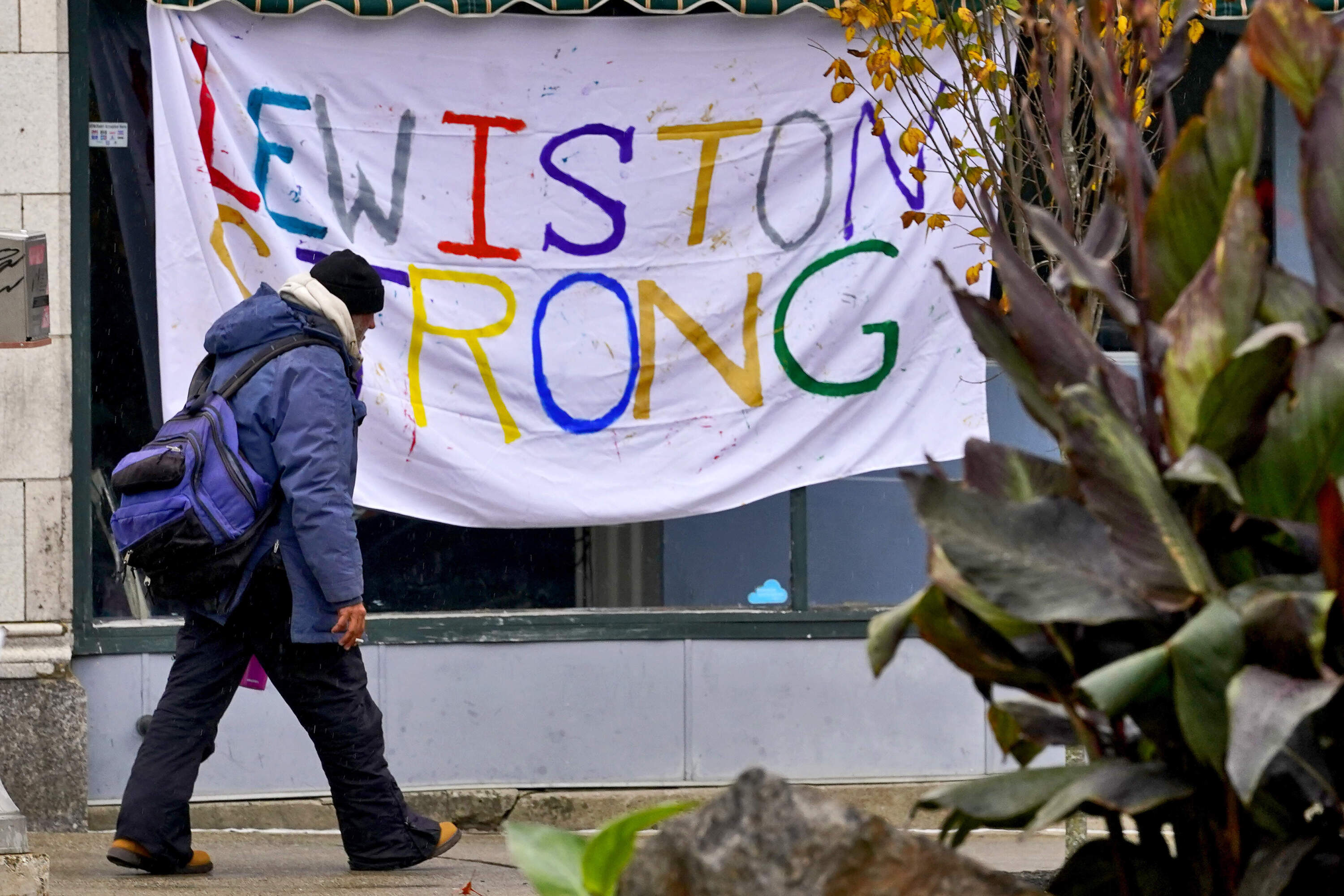 A man walks past a "Lewiston Strong" sign, Sunday, Oct. 29, 2023, in Lewiston, Maine. (Matt York/AP)