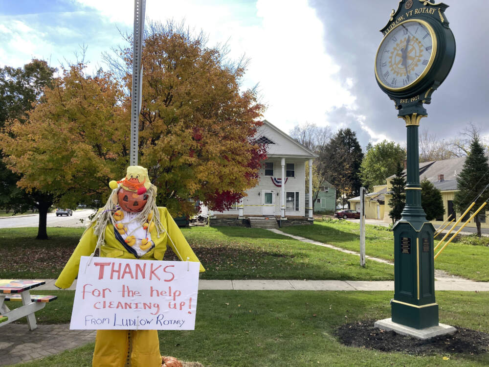 A sign rests on a halloween-themed figure, in Ludlow, Vt., thanking people for helping to clean up after the severe flooding in July of 2023. (Lisa Rathke/AP)