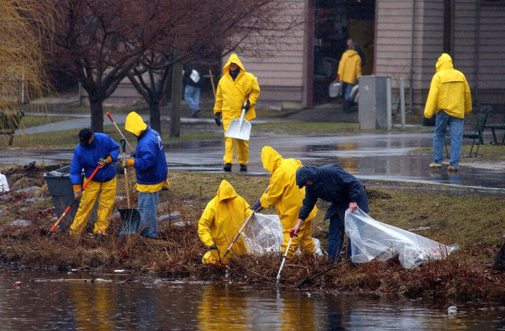 Parks department personnel helped pick up trash during the fourth annual Charles River Cleanup on the Esplanade on April 12, 2003. (Patrick Whittemore/MediaNews Group/Boston Herald via Getty Images)