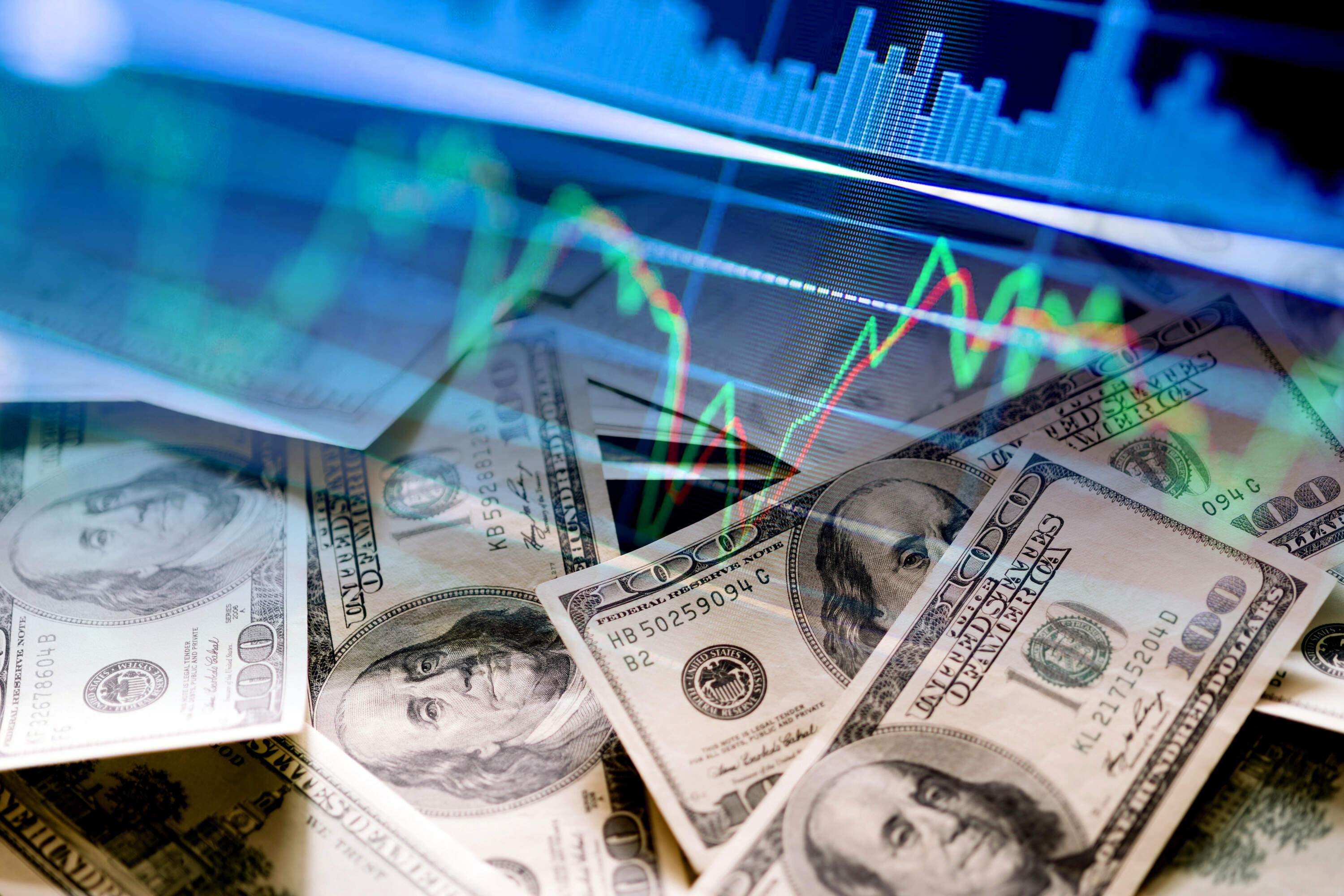 Dollar bills and stock market indicators. (Getty Images)