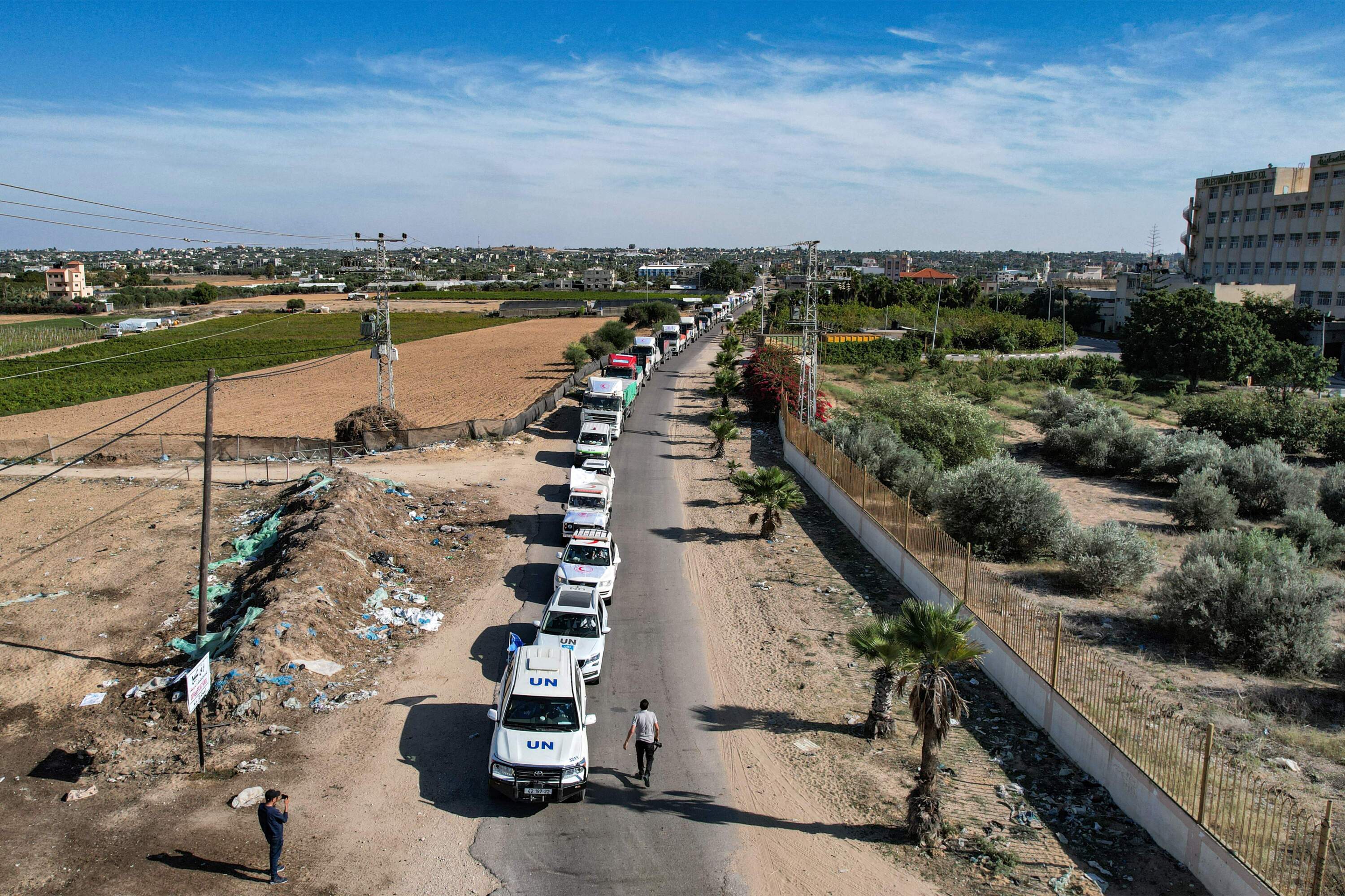 This aerial view shows humanitarian aid trucks arriving from Egypt after having crossed through the Rafah border crossing arriving at a storage facility in Khan Yunis in the southern Gaza Strip on Oct. 21, 2023. (Belal Al Sabbagh/AFP via Getty Images)