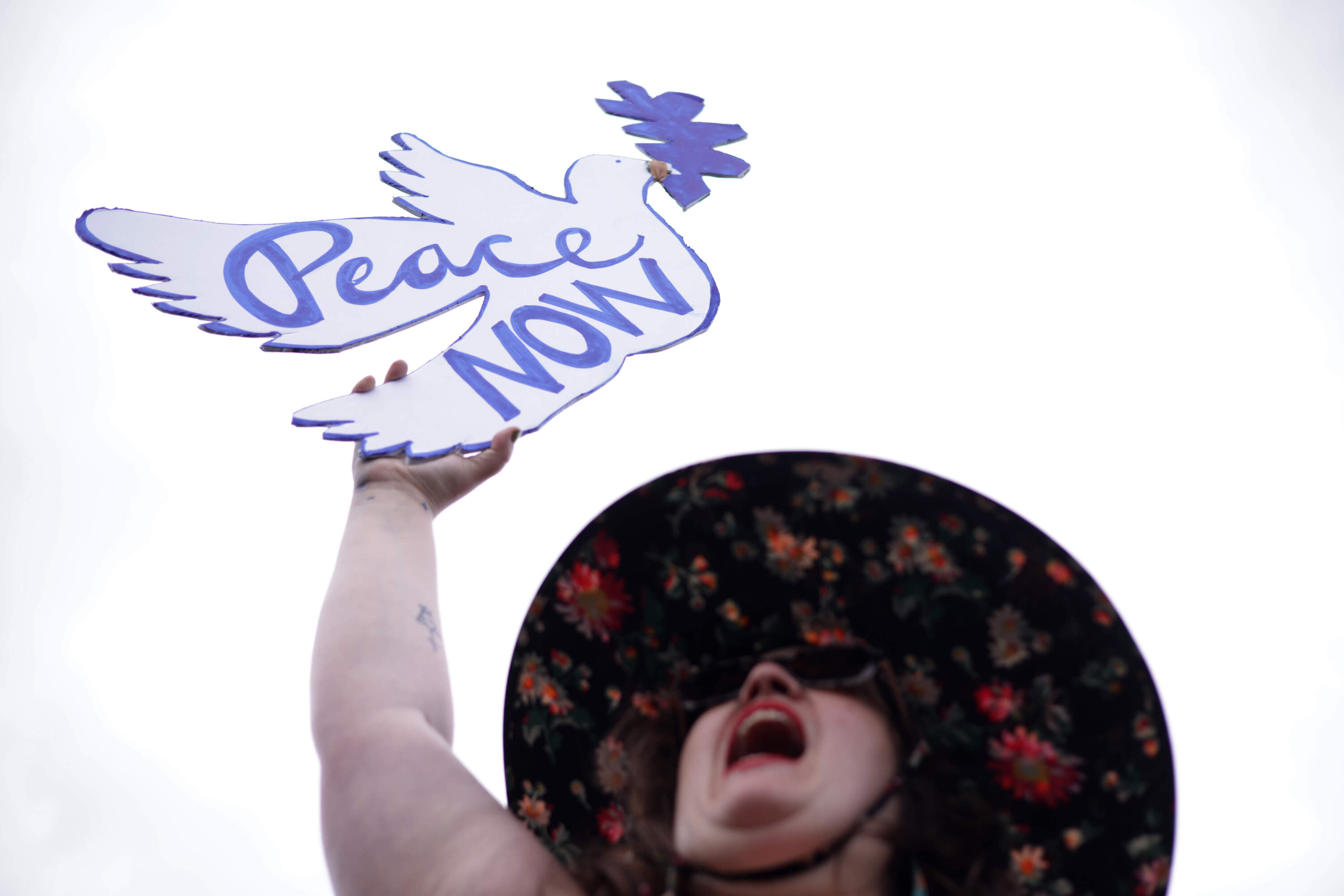 A protester holds up a sign that reads "Peace NOW" during a demonstration in support of a cease fire against the Palestinians in Gaza at the National Mall on October 18, 2023 in Washington, DC. Members of the Jewish Voice for Peace and the IfNotNow movement staged a rally to call for a cease fire in the Israel–Hamas war. (Alex Wong/Getty Images)