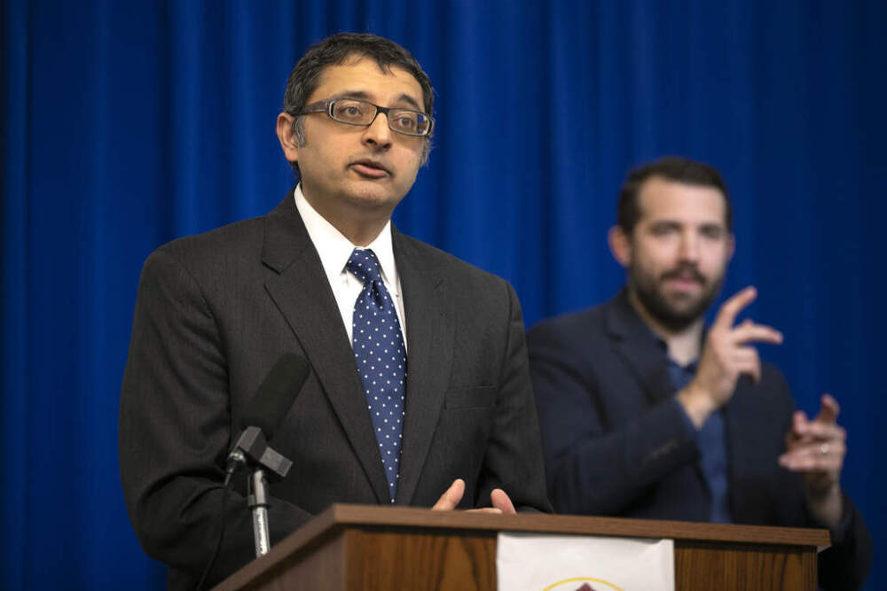 American Sign Language interpreter Joshua Seal, right, is seen at a news conference with Dr. Nirav Shah, director of the Maine Center for Disease Control and Prevention, on April 28, 2020, in Augusta, Maine. (Robert F. Bukaty/AP)