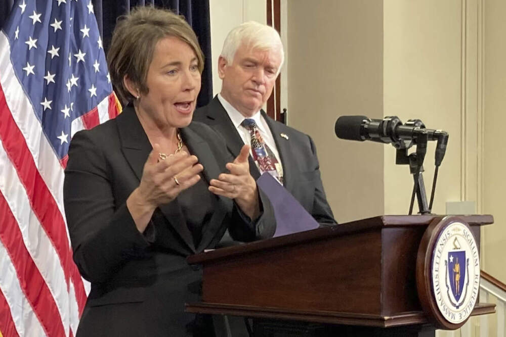 Gov. Maura Healey, accompanied by Lt. Gen. L. Scott Rice, who's tasked with overseeing changes to the state's family shelter system, speaking to reporters last month. (Steve LeBlanc.AP)