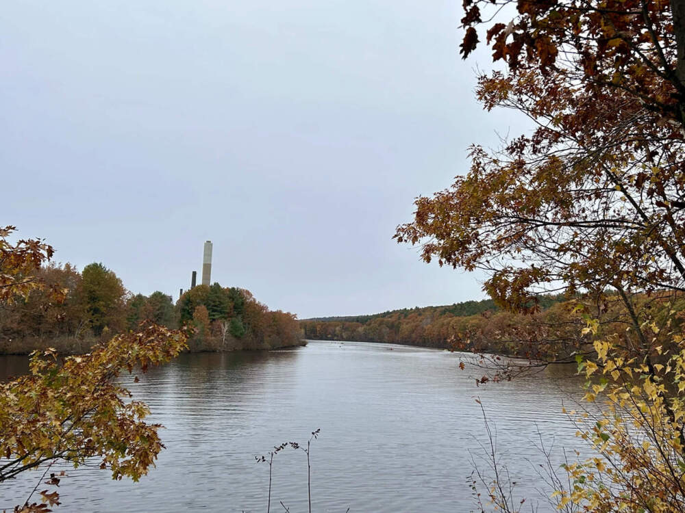 The Merrimack Generation Station sits on the banks of the Merrimack River. A small group of boaters can be seen paddling in the river, Oct. 29, 2023.