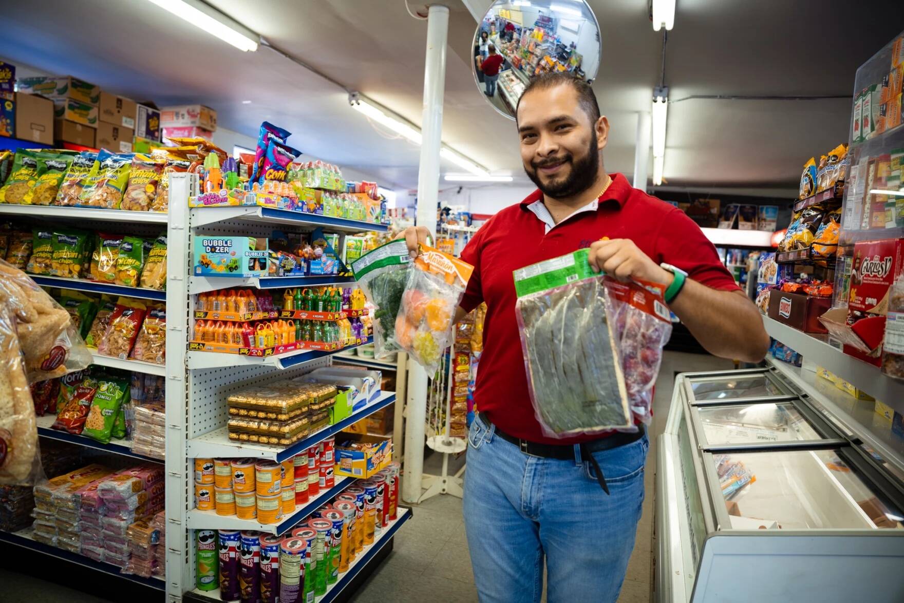 John Cardona, owner of New Hampshire grocery store El Parcero, identifies as Hispanic rather than Colombian because he says that makes him feel part of something bigger. (Gabriela Lozada/ NHPR)