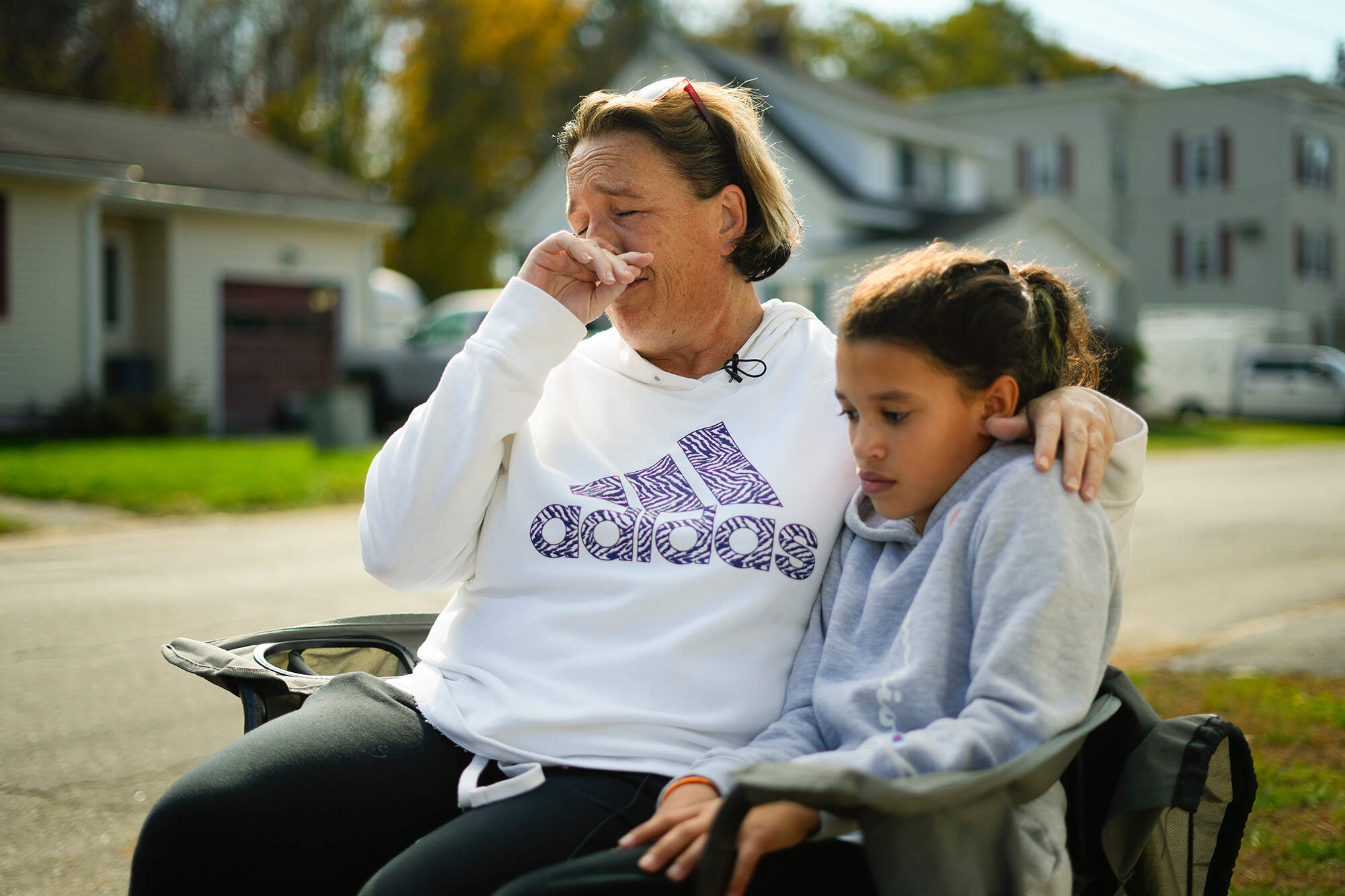 Tammy Asselin, who was at the Schemengees Bar and Grille with her daughter, Toni, during the recent mass shooting, wipes her face during an interview in Lewiston, Maine on Friday. (Matt Rourke/AP)