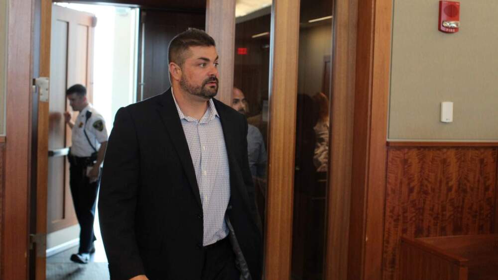 Michael Pessoa walks into a courtroom during his criminal trial in May 2023. (Ben Berke/ The Public's Radio)